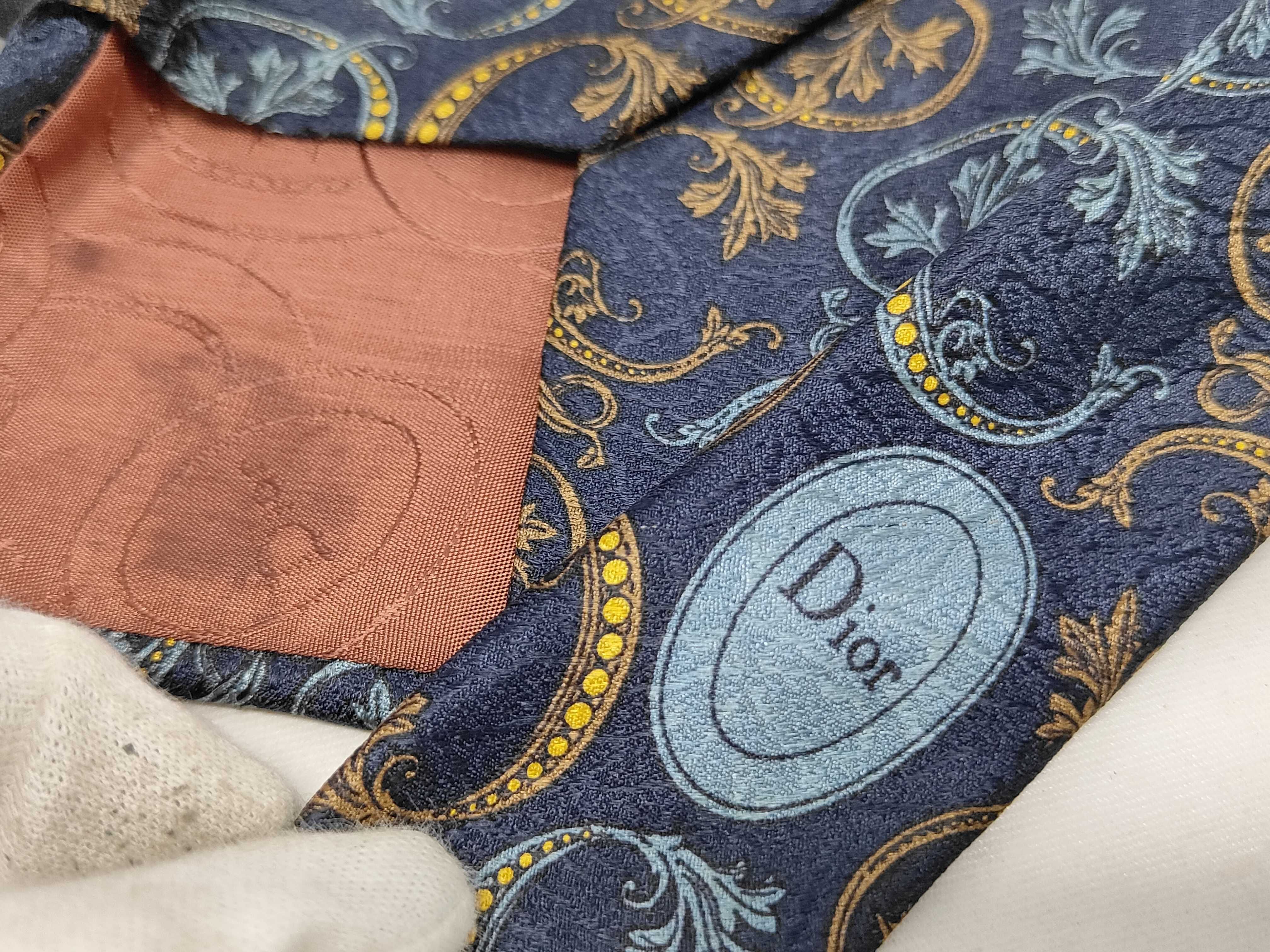 A Trio of Luxury Designer Silk Neckties Including Gucci, Louis Vuitton, and Christian Dior
