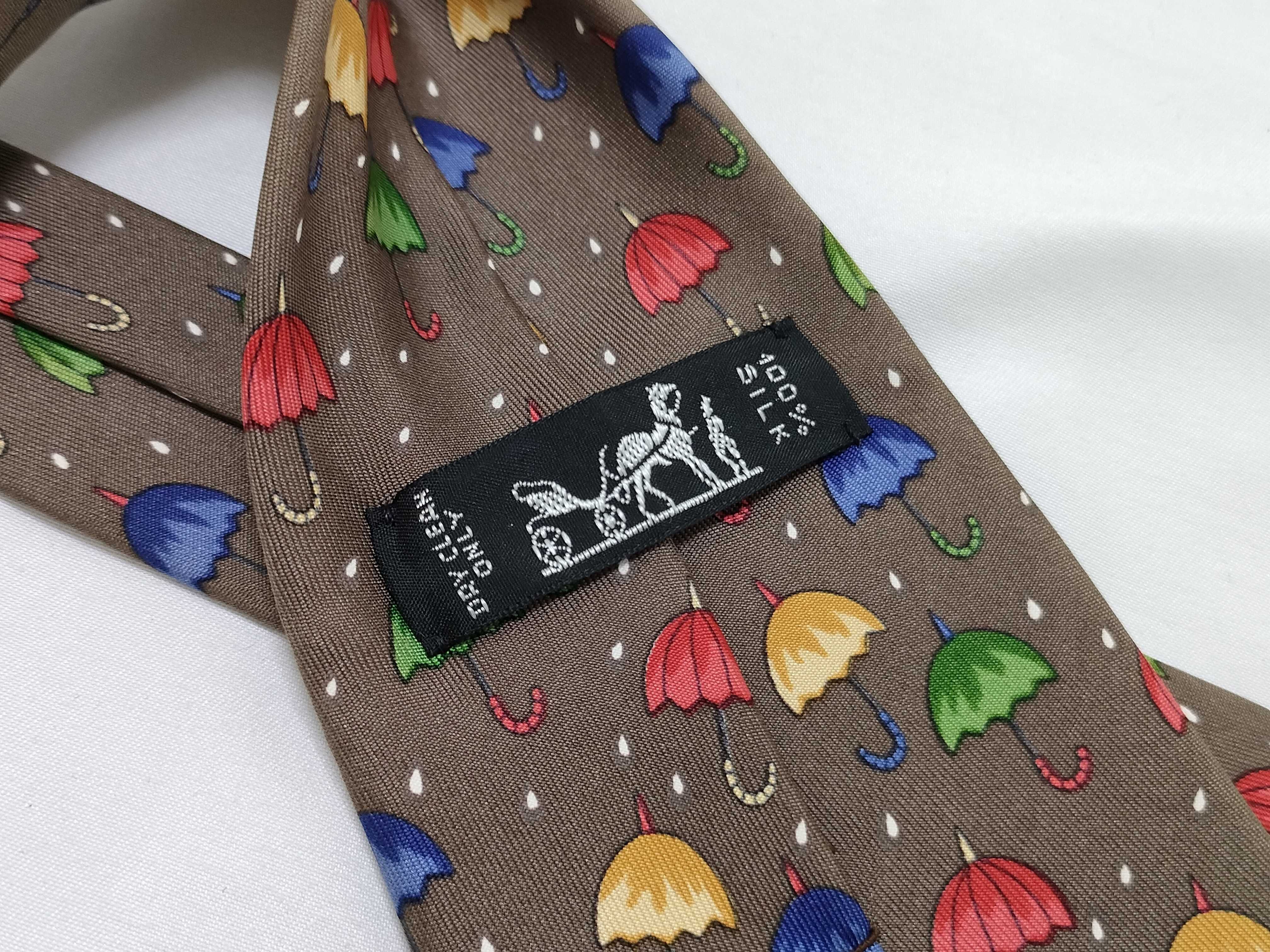 Two Hermes Silk Neckties Featuring Umbrella and Geometric Patterns