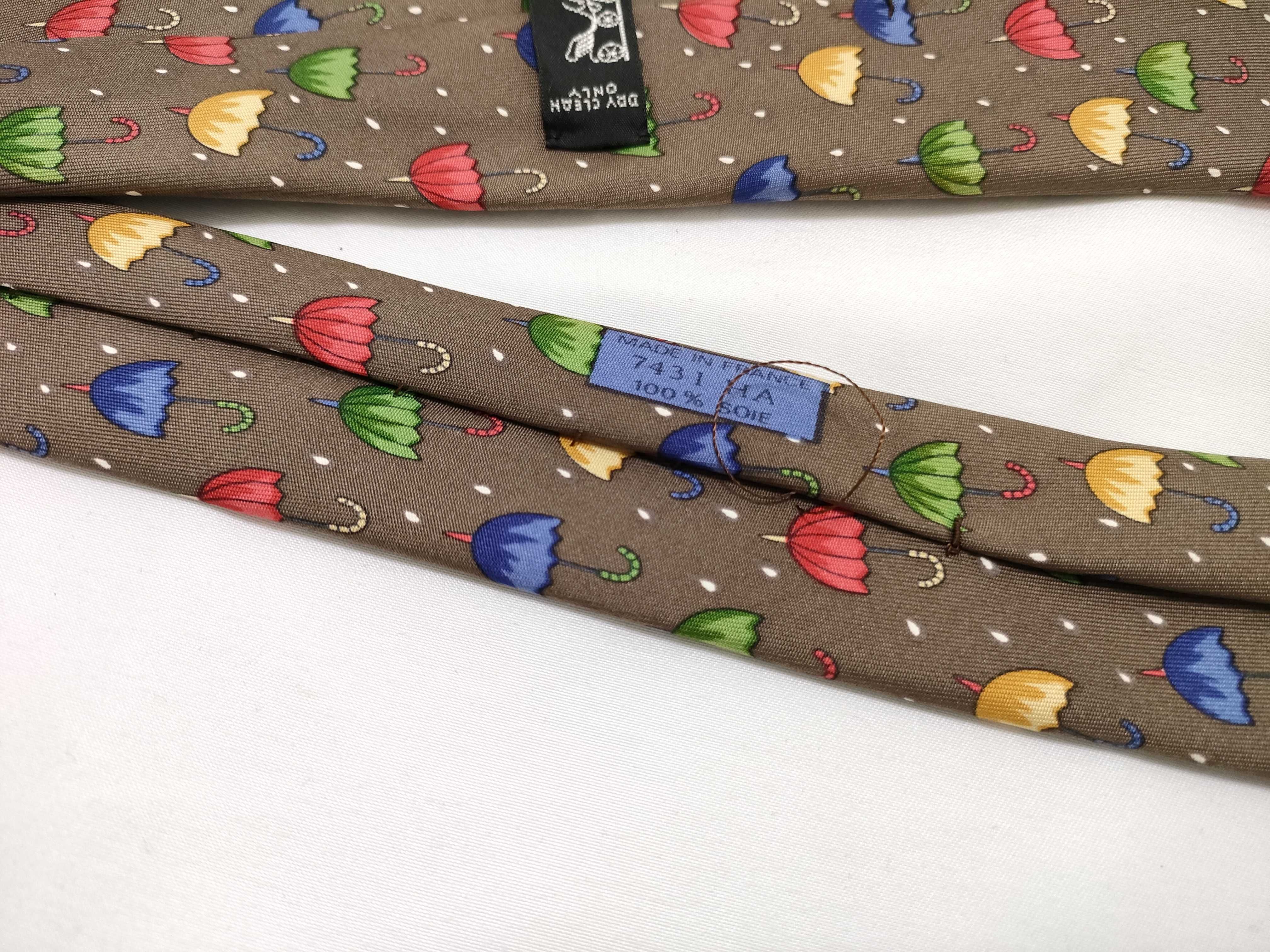 Two Hermes Silk Neckties Featuring Umbrella and Geometric Patterns