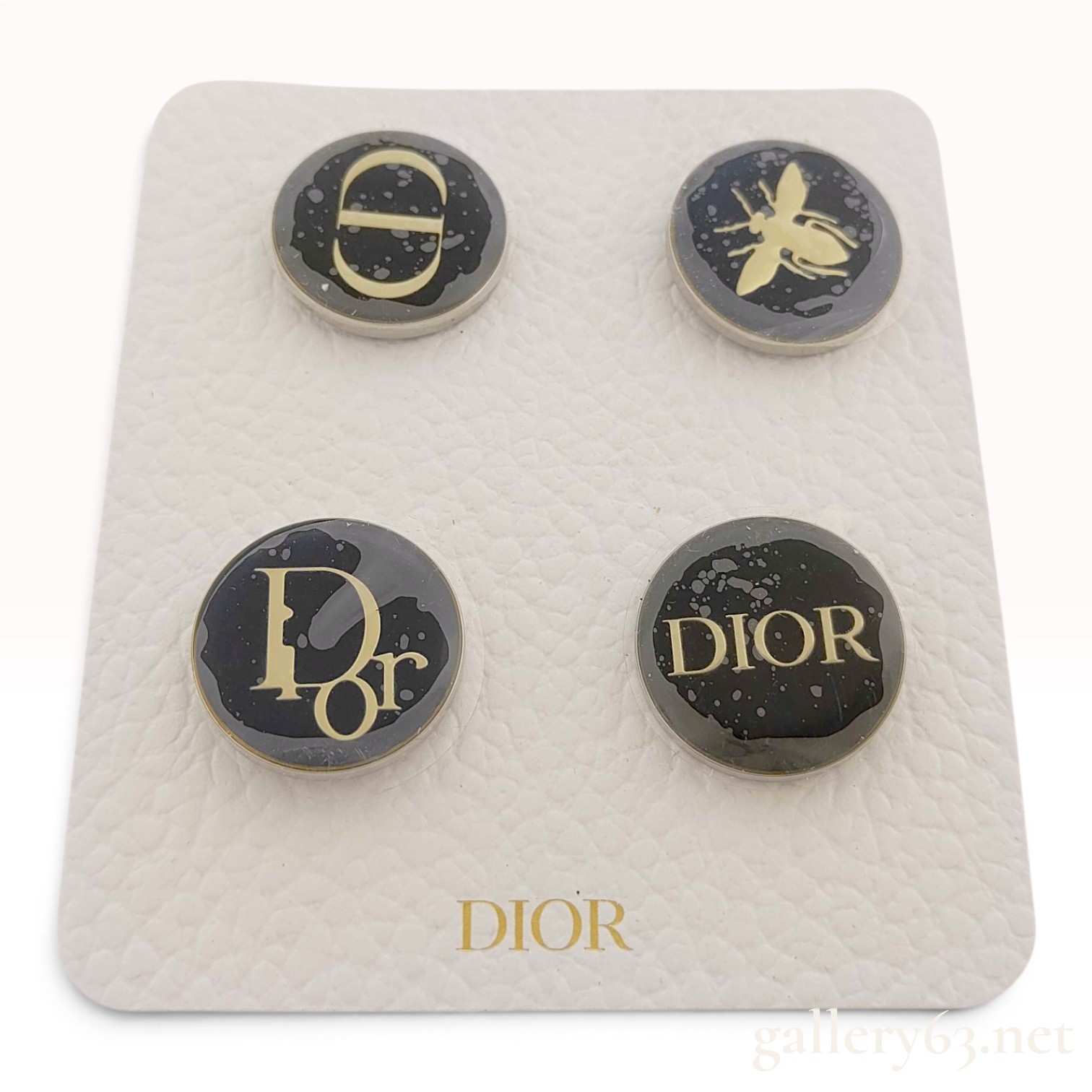 A Set of Four Dior Beaute Novelty Circular Lapel Pins
