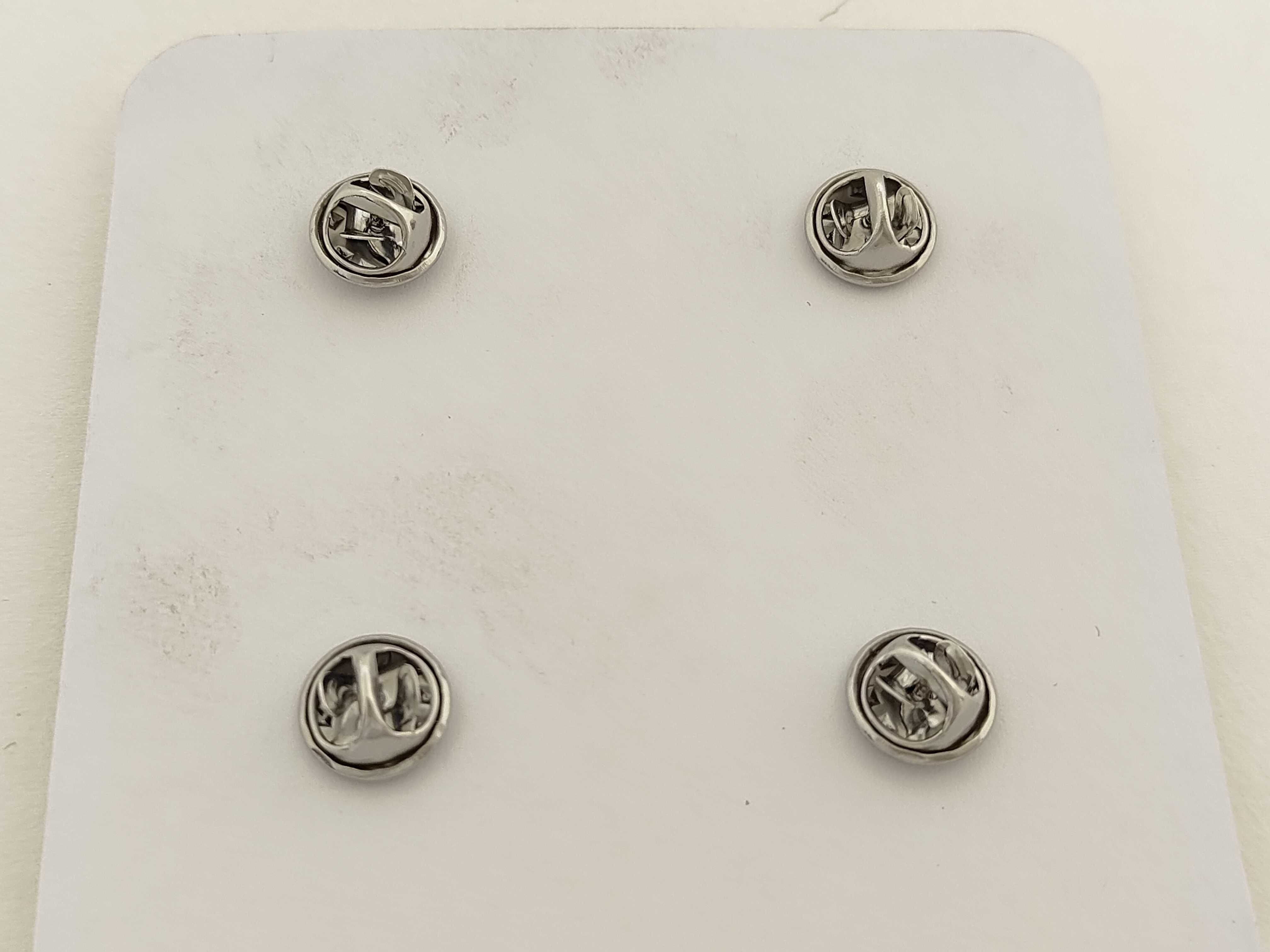 A Set of Four Dior Beaute Novelty Circular Lapel Pins