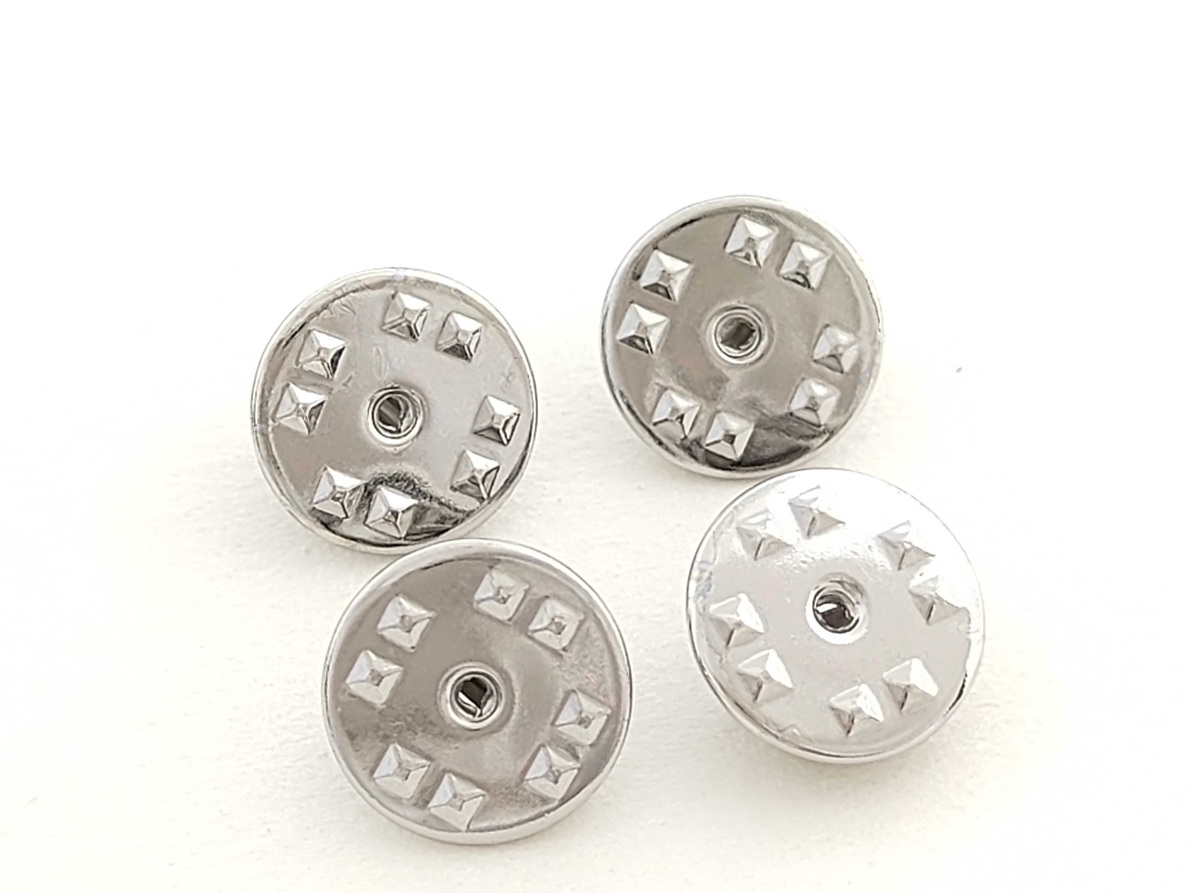 A Set of Four Dior Beaute Novelty Circular Lapel Pins