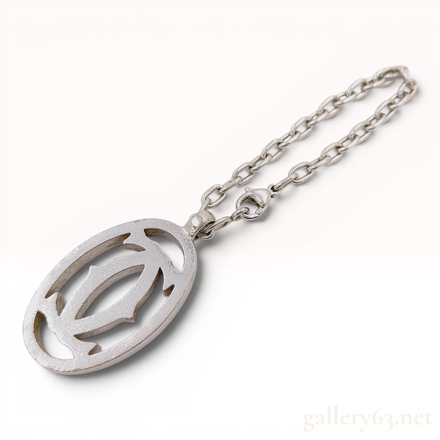 Cartier silver toned metal Double C logo bag charm