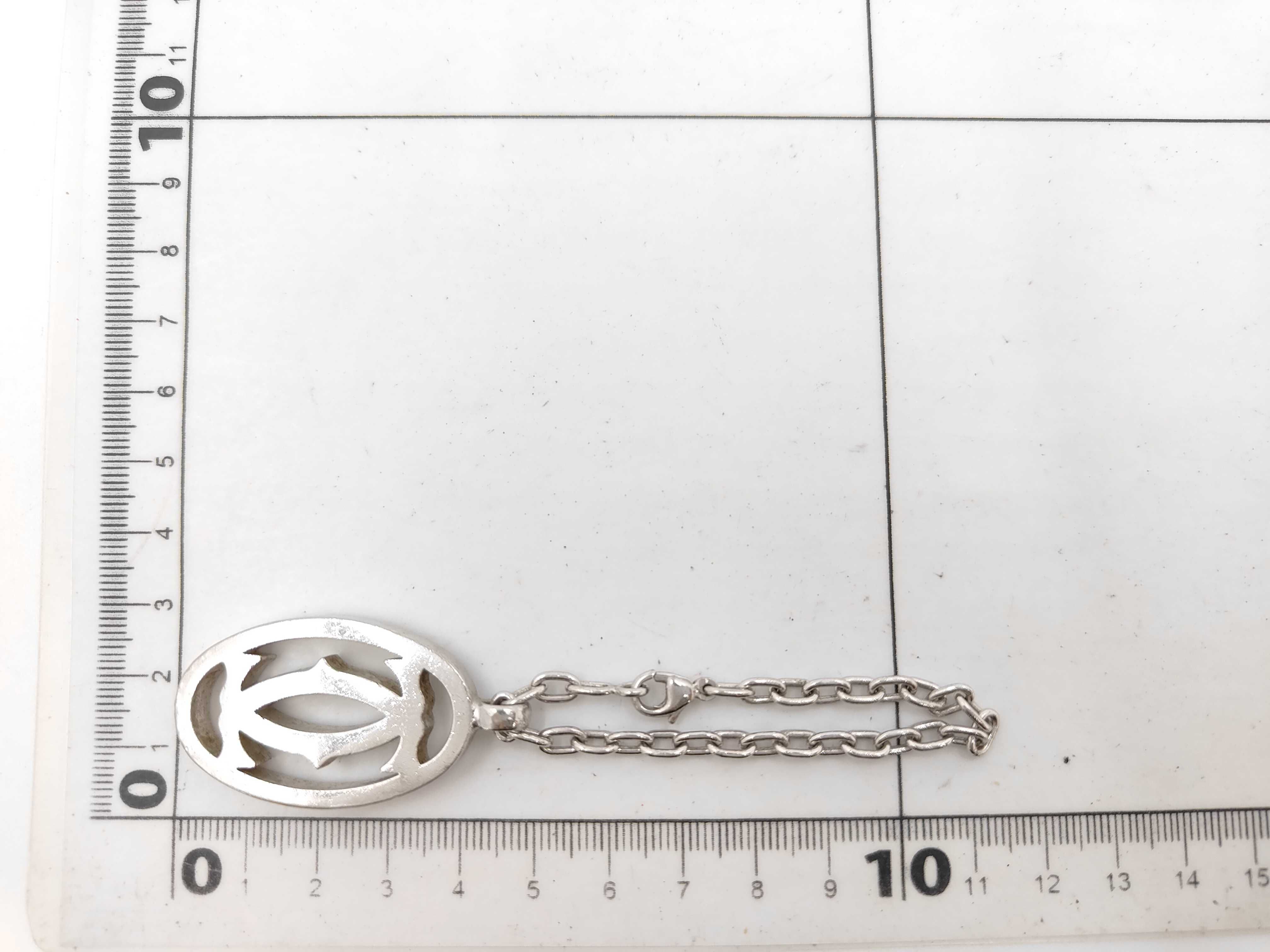 Cartier silver toned metal Double C logo bag charm