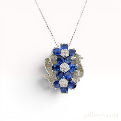 18K White Gold Natural Sapphire and Diamond Floral Pendant Necklace. An 18 karat white gold 