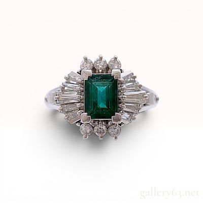 Vintage Natural Emerald and Diamond Ballerina Ring in Platinum. A vintage ballerina style 