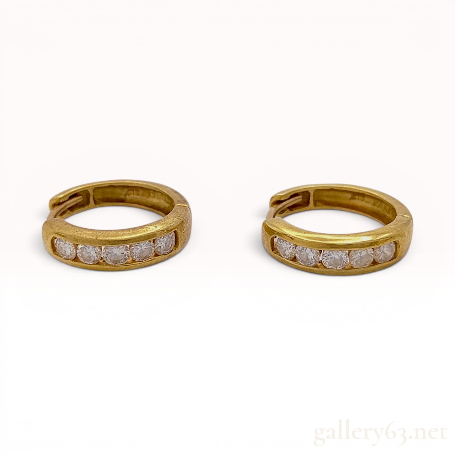 A Pair of 18 Karat Yellow Gold and Diamond Channel-Set Huggie Hoop Earrings