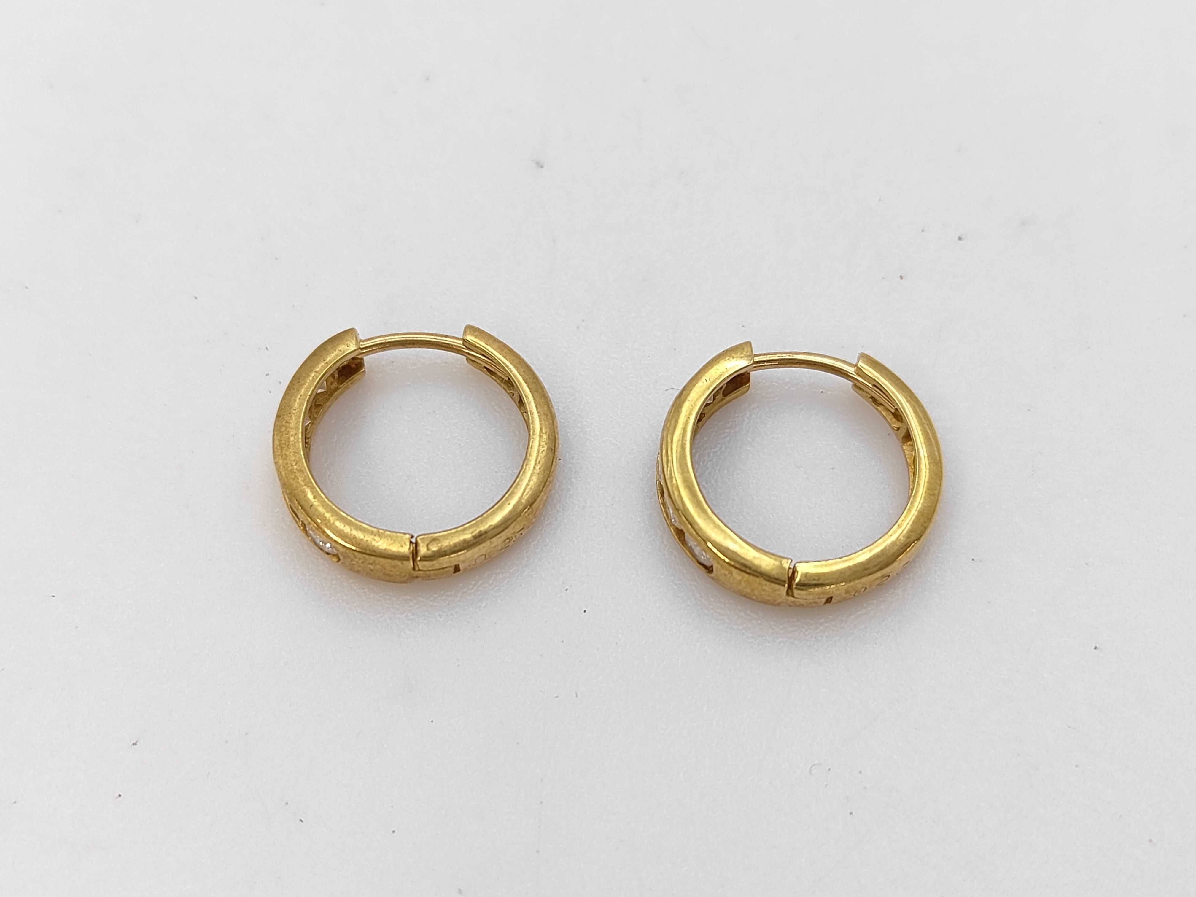 A Pair of 18 Karat Yellow Gold and Diamond Channel-Set Huggie Hoop Earrings