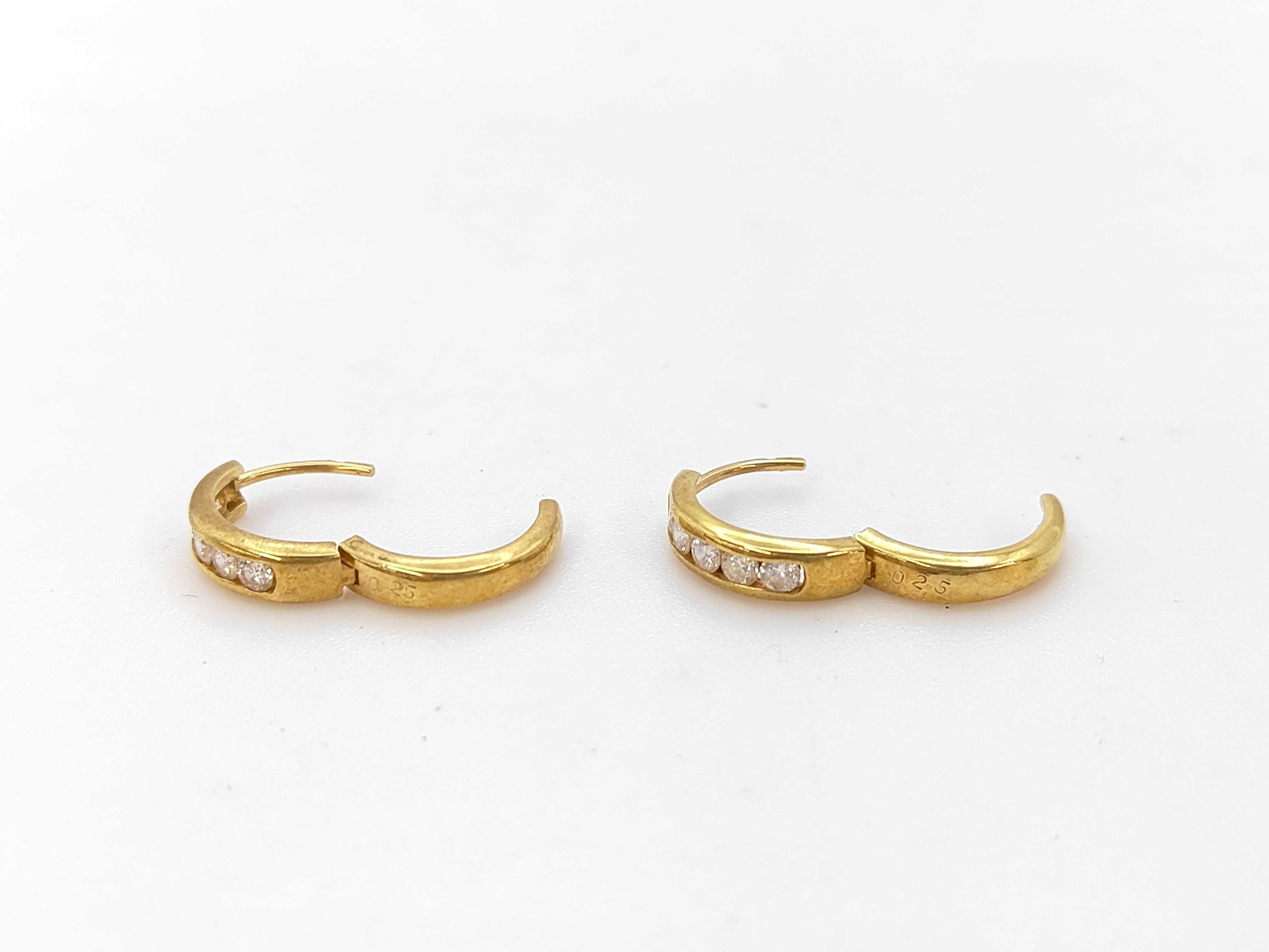 A Pair of 18 Karat Yellow Gold and Diamond Channel-Set Huggie Hoop Earrings