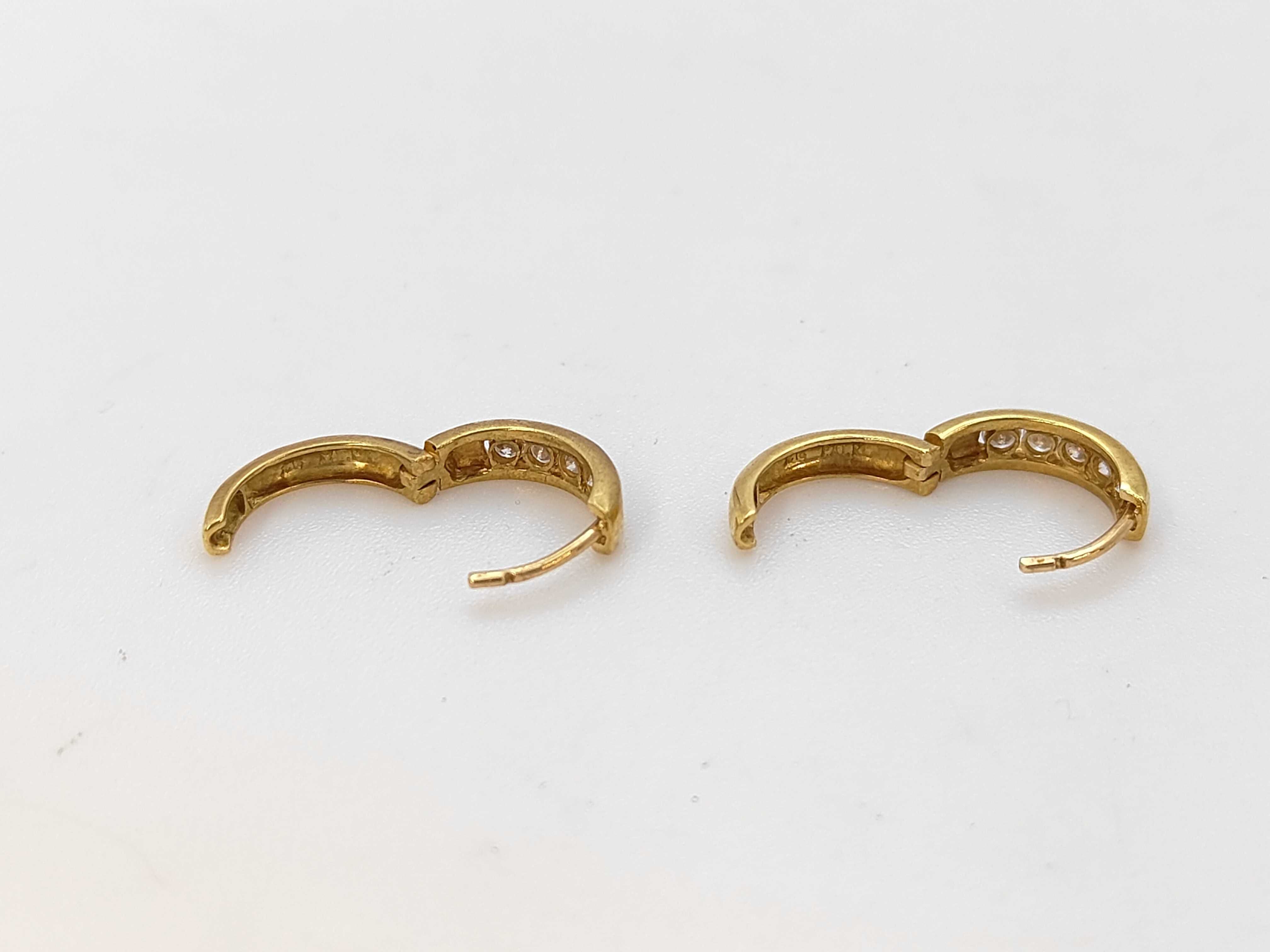 A Pair of 18 Karat Yellow Gold and Diamond Channel-Set Huggie Hoop Earrings