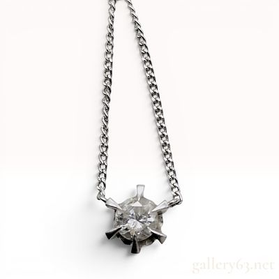 0.80 Carat Diamond Solitaire Platinum Starburst Pendant Necklace. A solitaire pendant necklace 