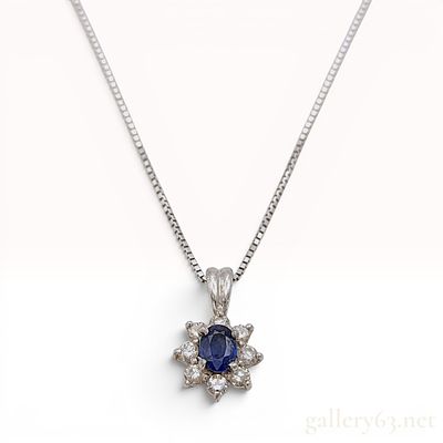 Sapphire and Diamond Halo Pendant in Platinum on an 18K White Gold Box Chain. This pendant 