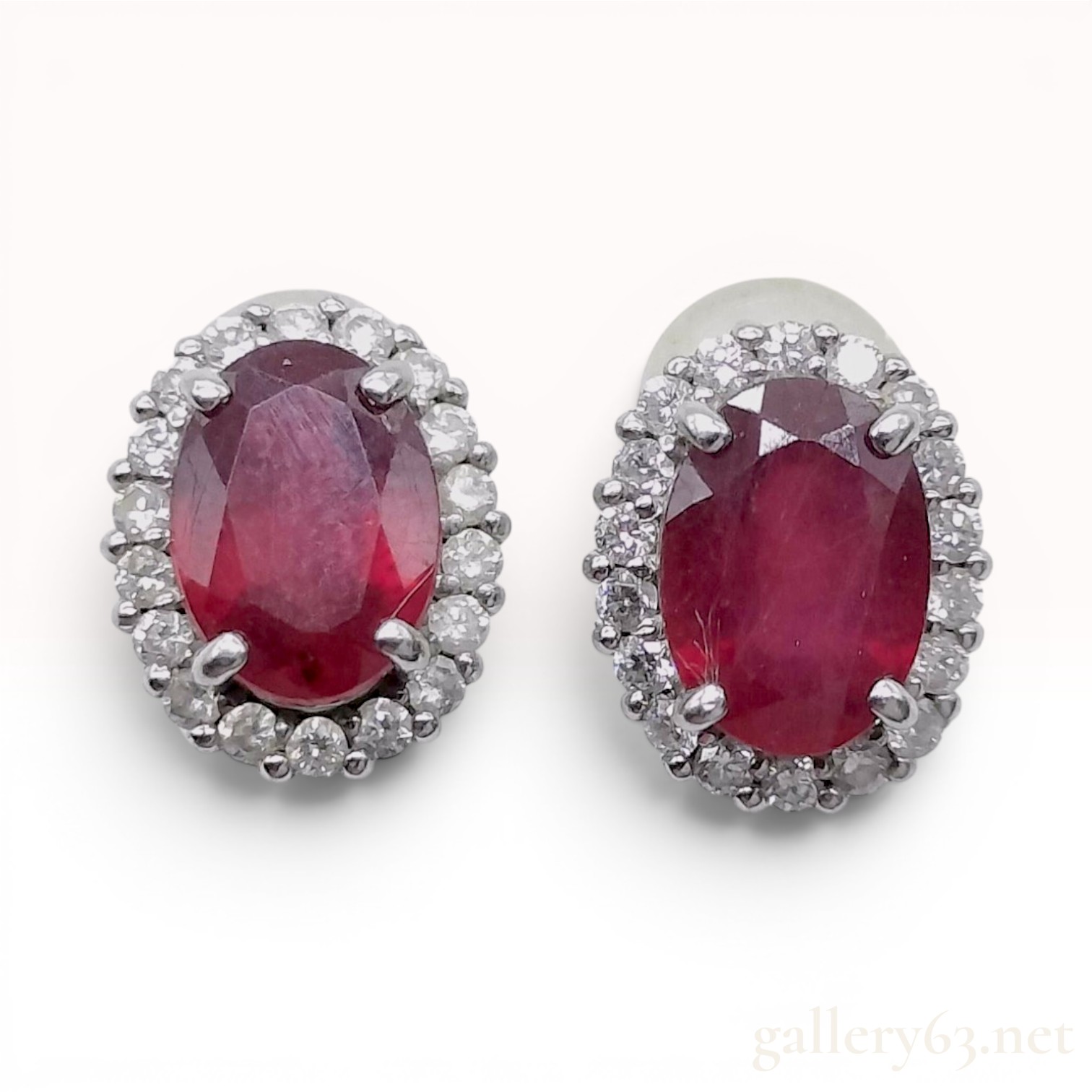 A Pair of Natural Ruby and Diamond Halo Stud Earrings in 900 Platinum