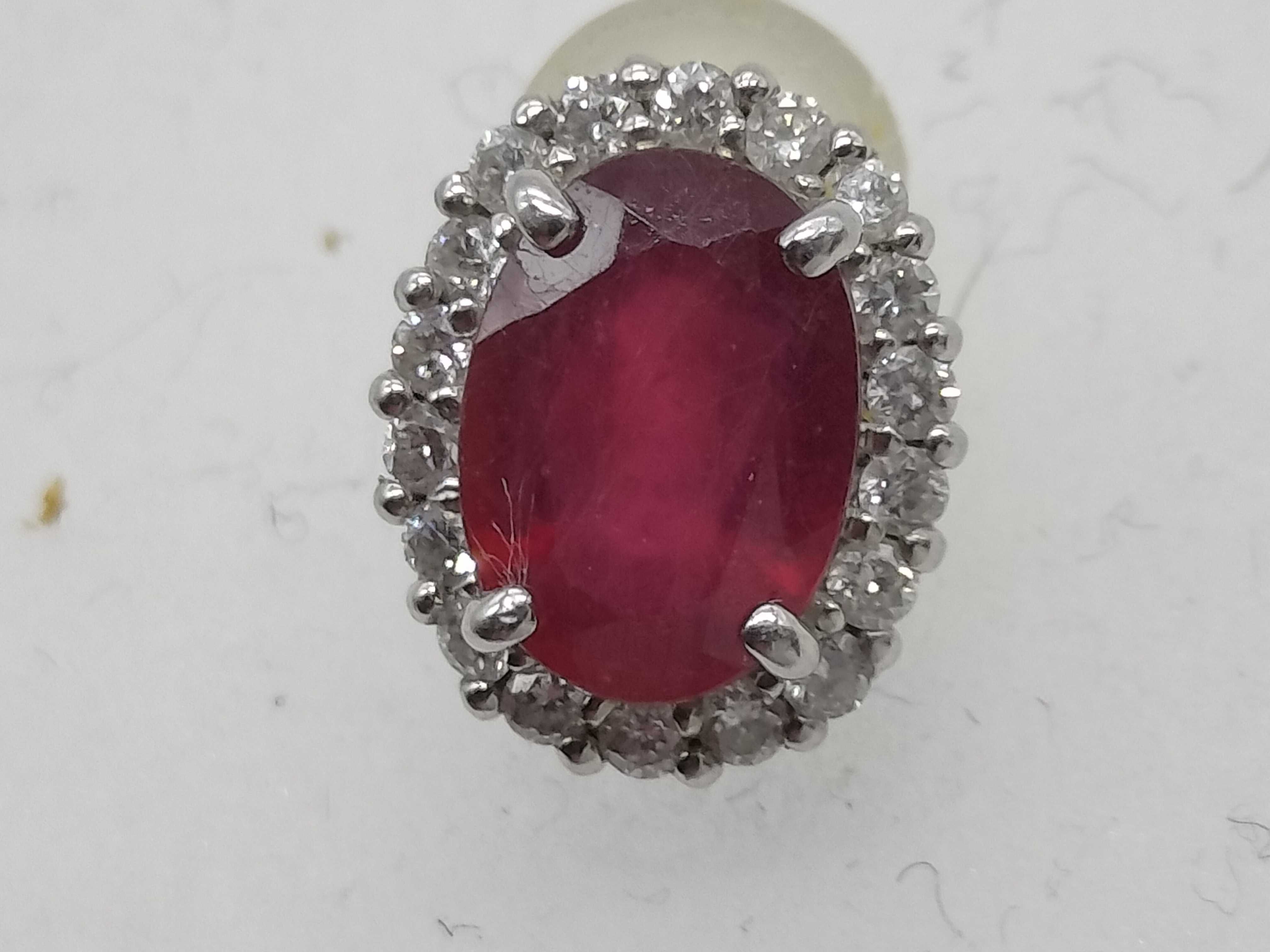 A Pair of Natural Ruby and Diamond Halo Stud Earrings in 900 Platinum