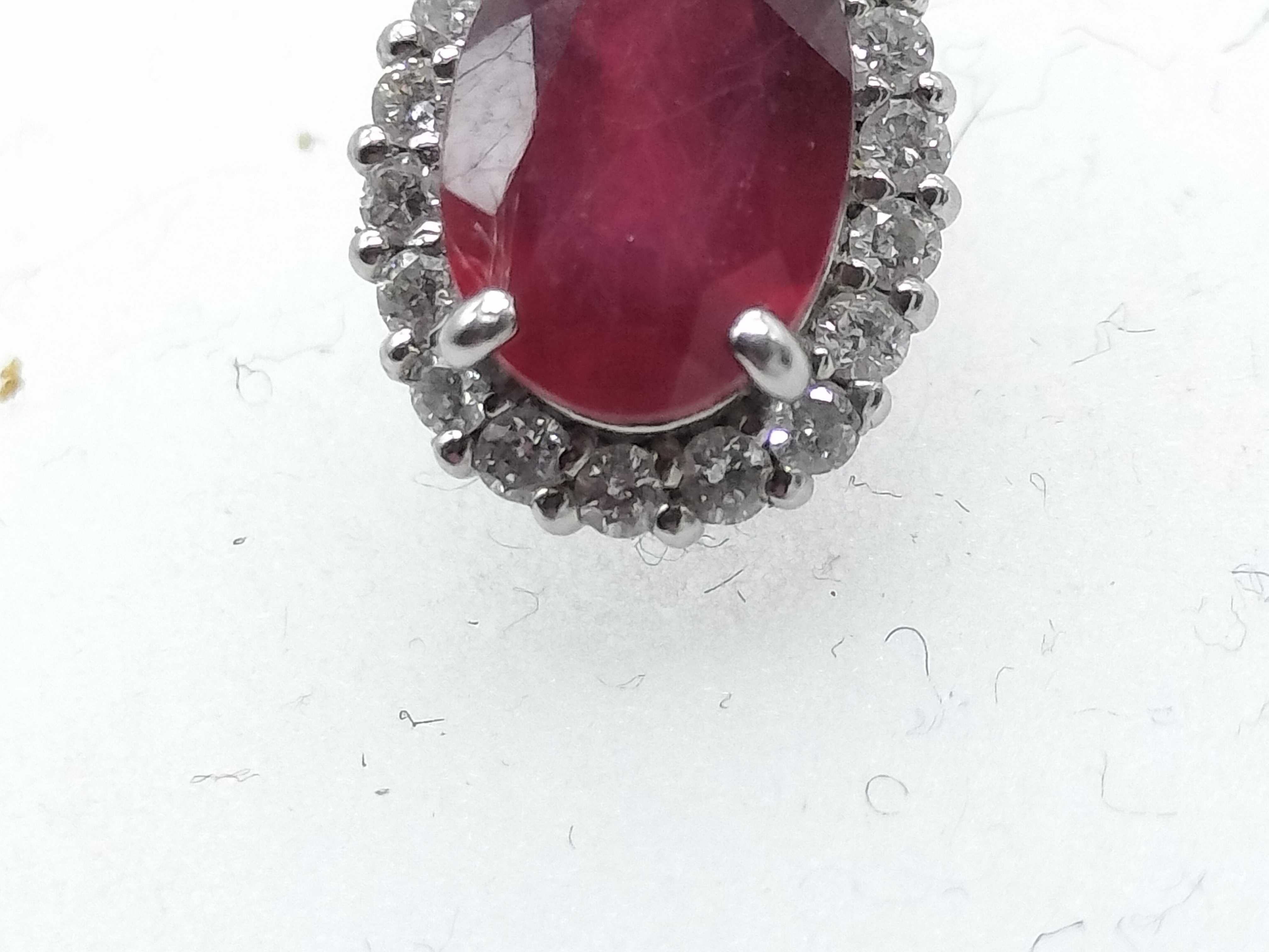 A Pair of Natural Ruby and Diamond Halo Stud Earrings in 900 Platinum