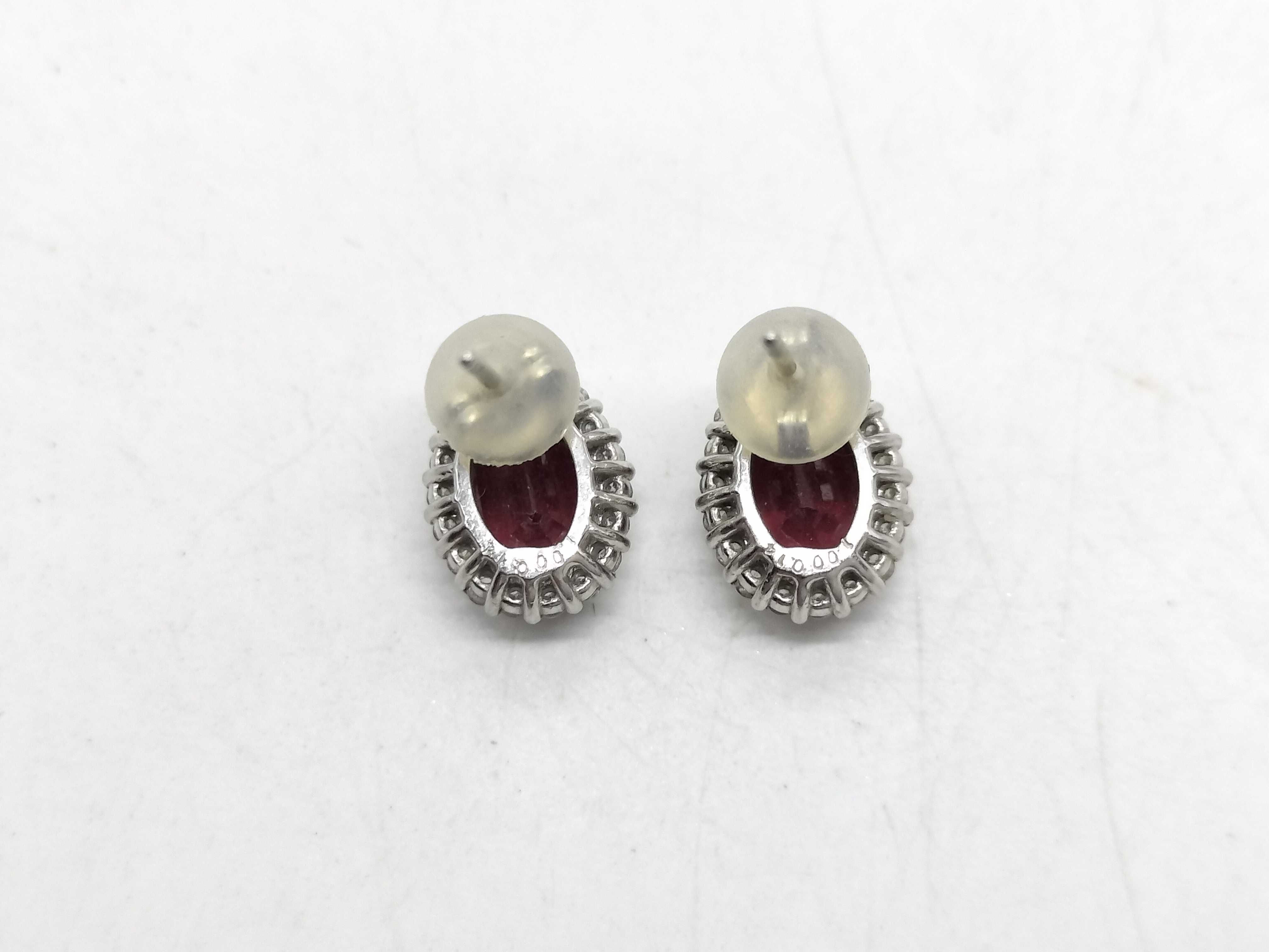 A Pair of Natural Ruby and Diamond Halo Stud Earrings in 900 Platinum