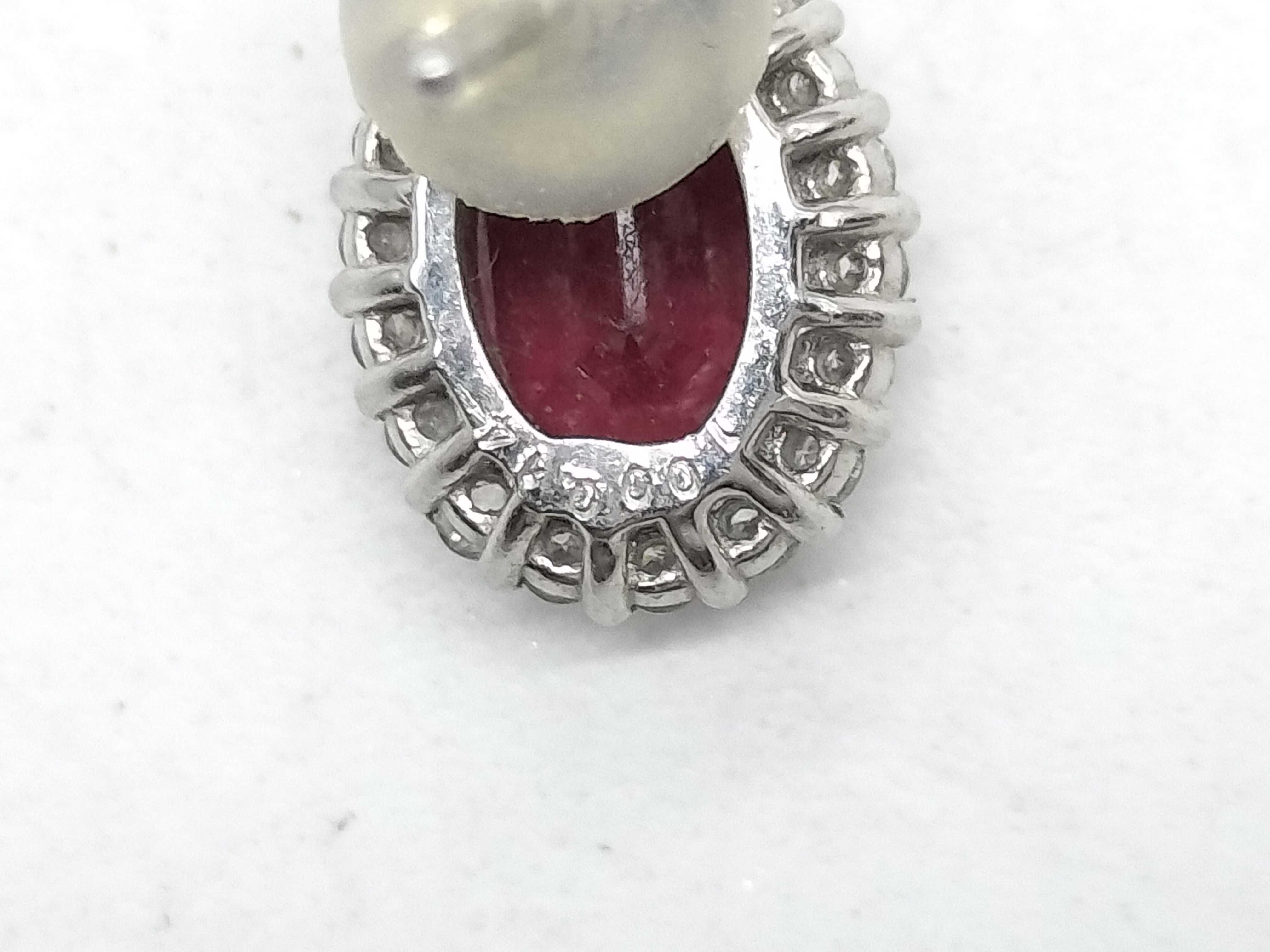 A Pair of Natural Ruby and Diamond Halo Stud Earrings in 900 Platinum