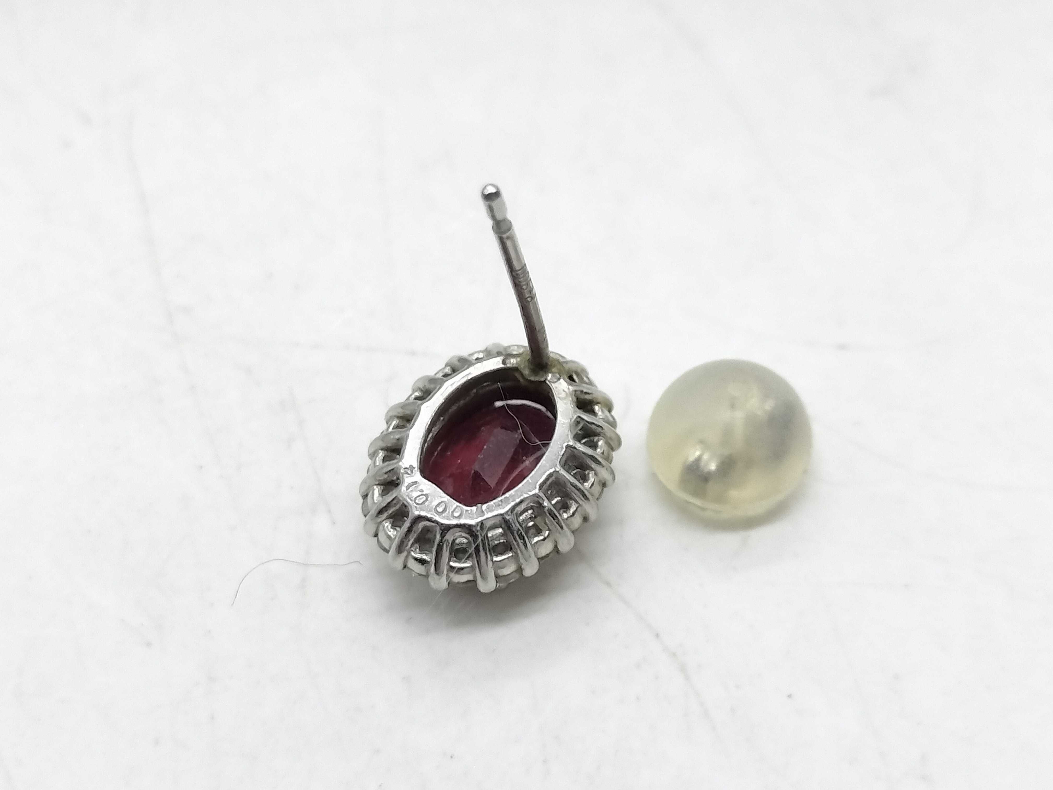 A Pair of Natural Ruby and Diamond Halo Stud Earrings in 900 Platinum