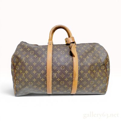 Louis Vuitton Monogram Keepall 55 Travel Bag. A Louis Vuitton Keepall 55 travel bag crafted from 