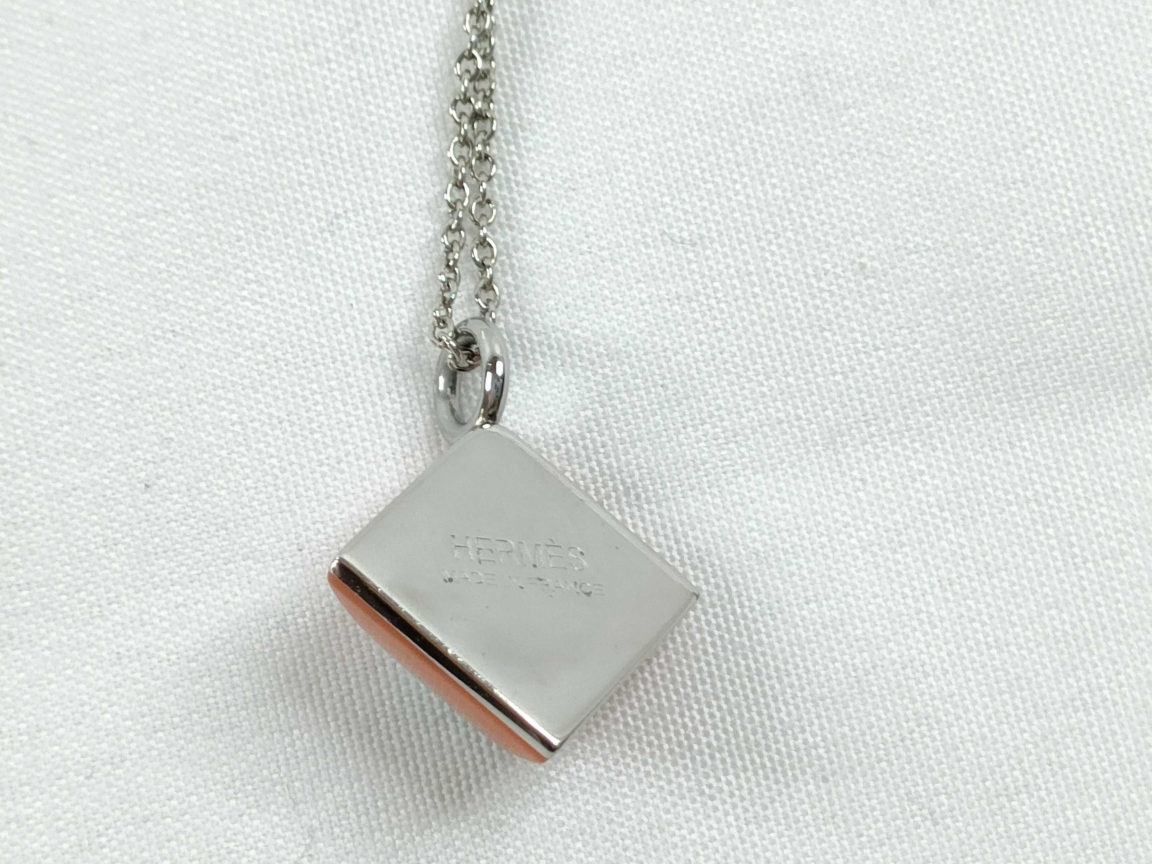Hermes Medor Cupidon Orange Enamel and Silver Tone Pendant Necklace