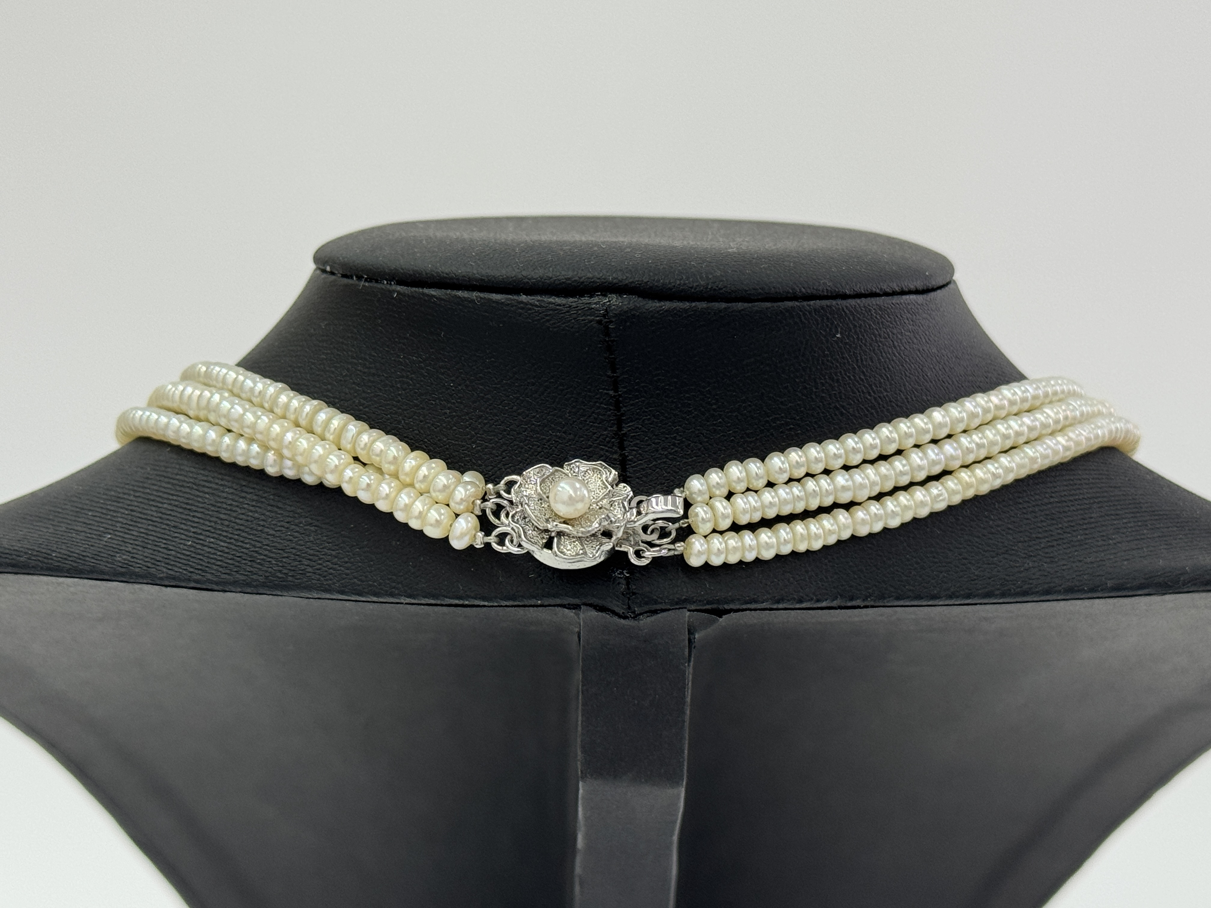Triple Strand Semi-Round Pearl Necklace with Silver Floral Clasp