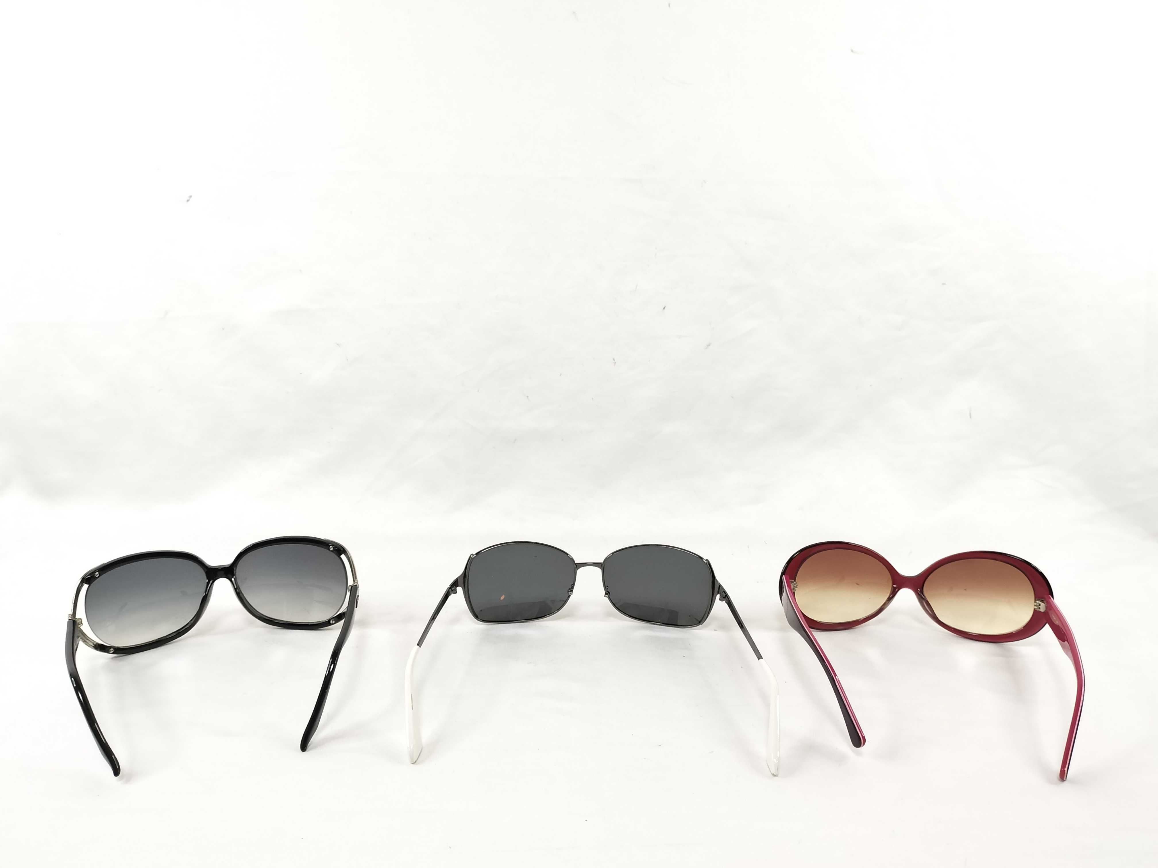 Three Pairs of Sunglasses including Examples by Christian Dior and Coach
