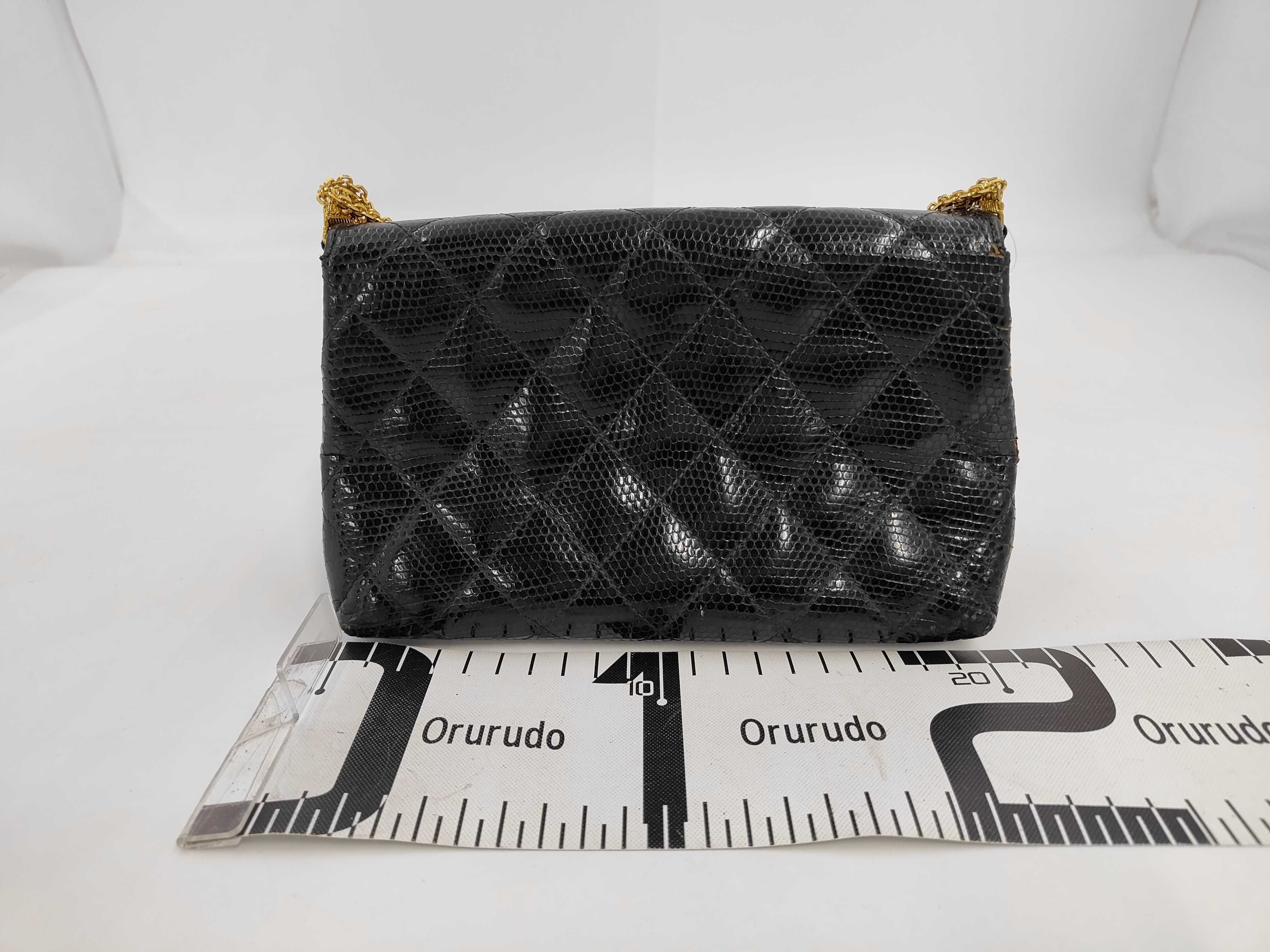 An Important Chanel Vintage Black Quilted Lizard Skin Flap Bag with Multi-Strand Gold-Plated Chain, 0 Series 1984-1986