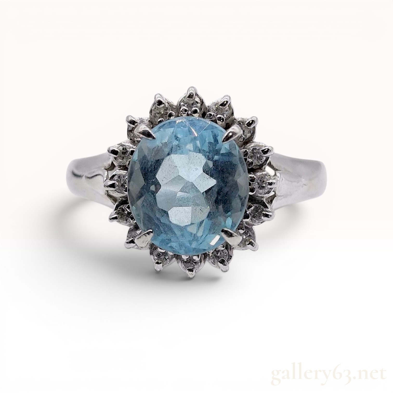 An Aquamarine and Diamond Halo Ring in Platinum