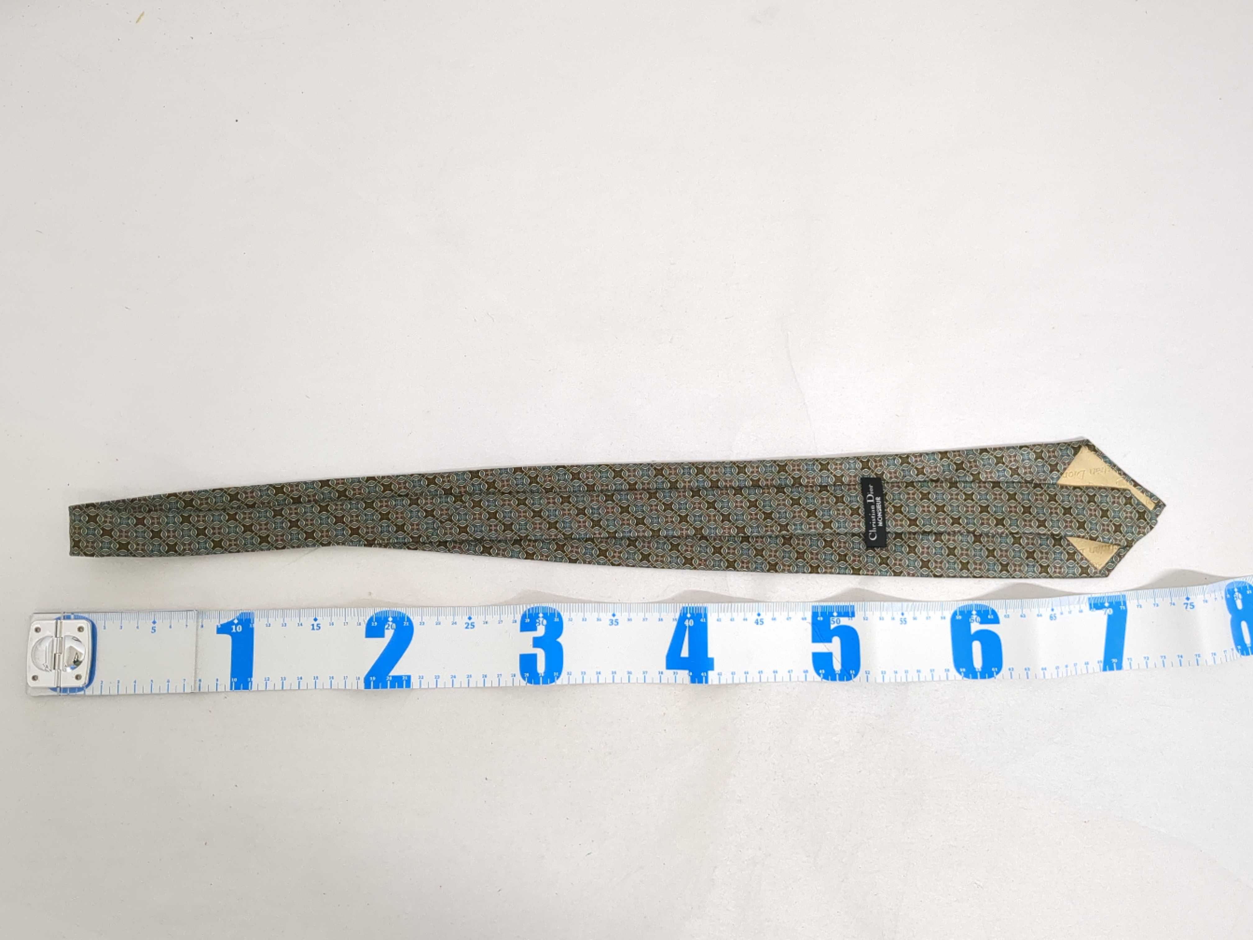 A Trio of Designer Silk Neckties including Christian Dior, Alfred Dunhill, and Chanel