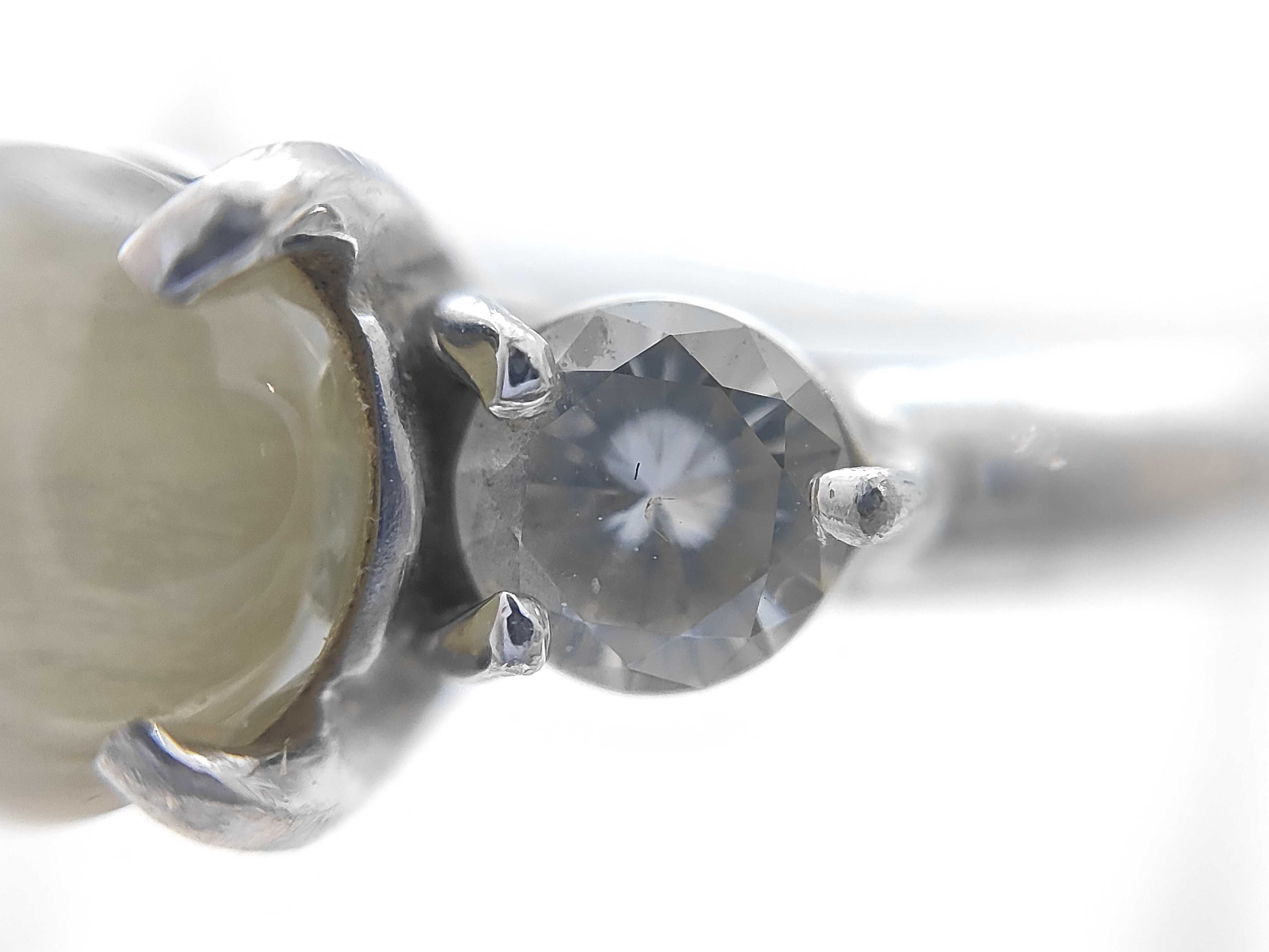 Platinum Chrysoberyl Cat's-Eye and Diamond Three-Stone Ring