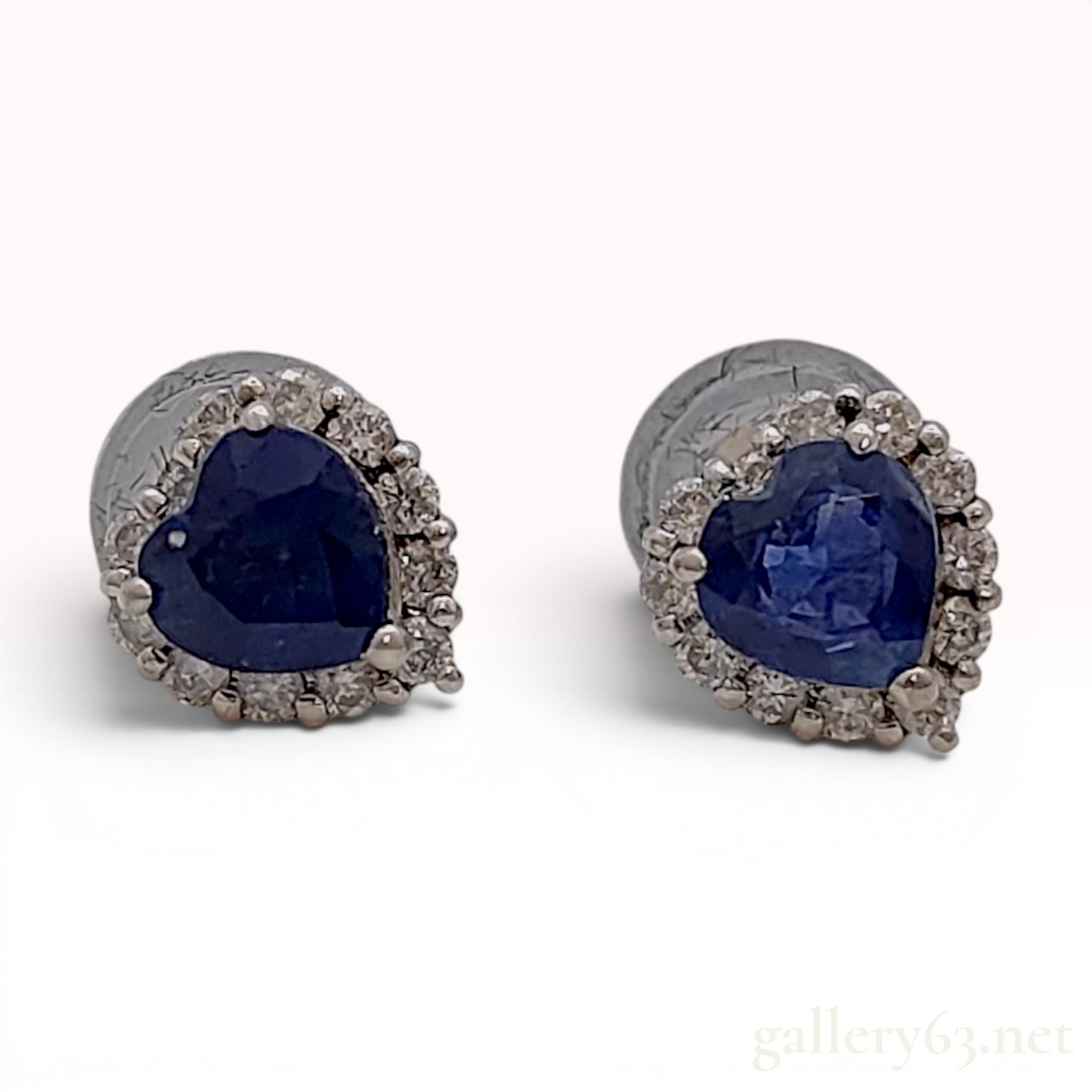 A Pair of 18 Karat White Gold Heart-Cut Sapphire and Diamond Halo Stud Earrings
