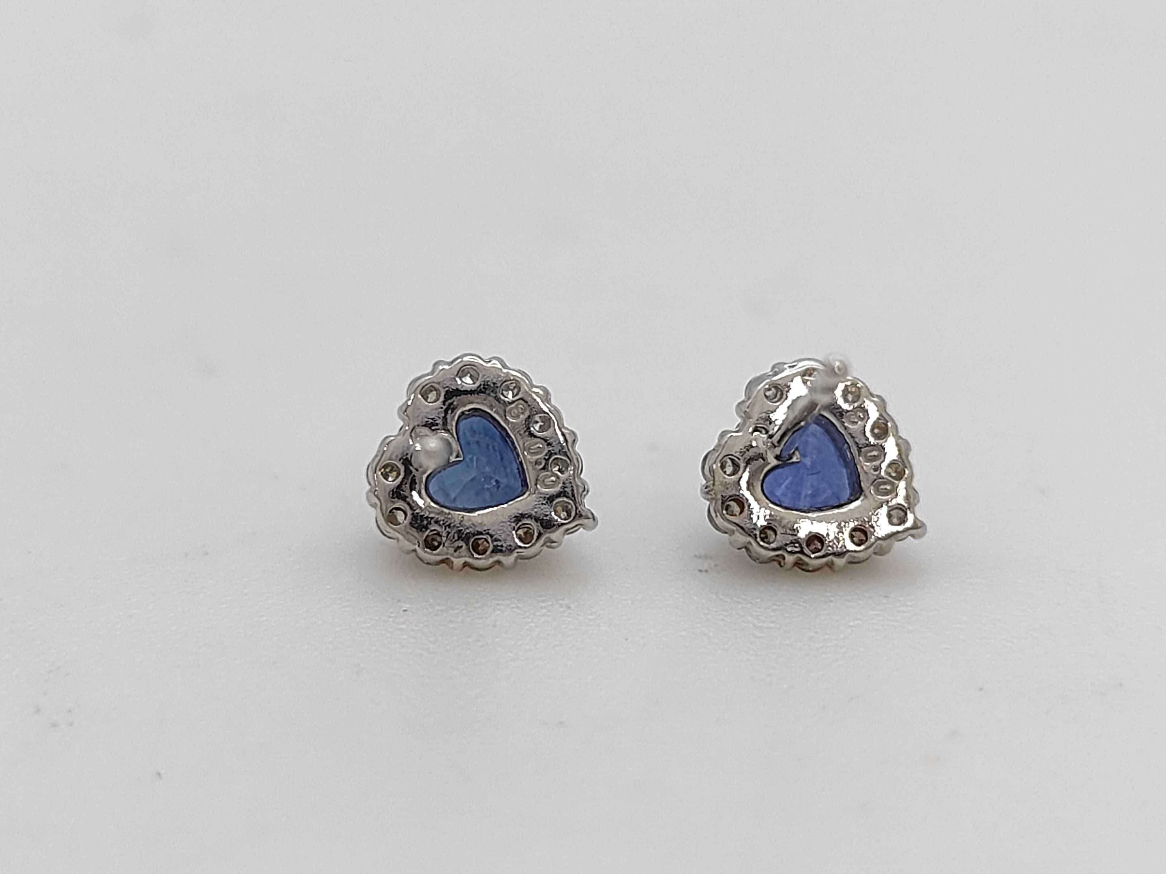 A Pair of 18 Karat White Gold Heart-Cut Sapphire and Diamond Halo Stud Earrings