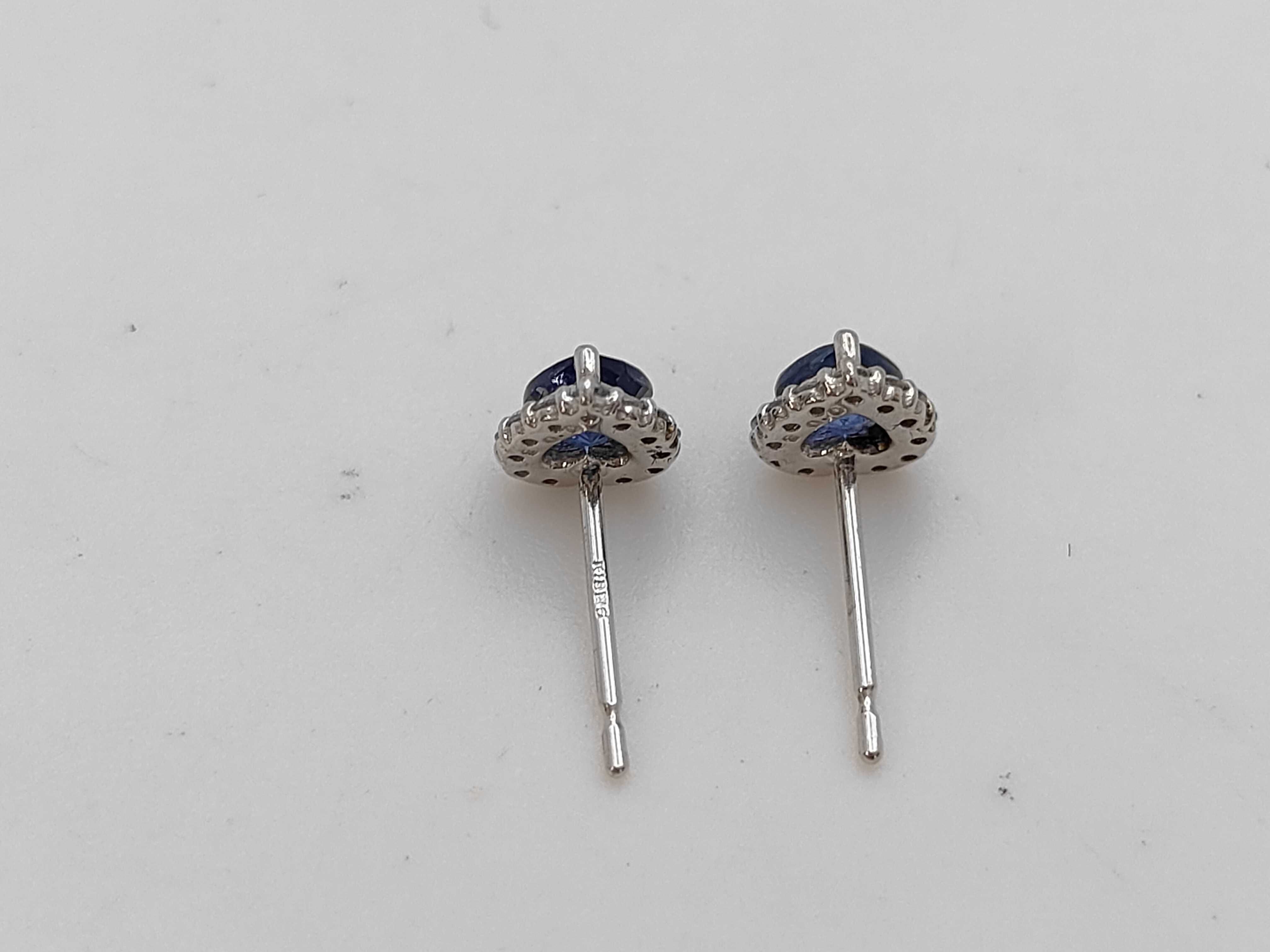 A Pair of 18 Karat White Gold Heart-Cut Sapphire and Diamond Halo Stud Earrings