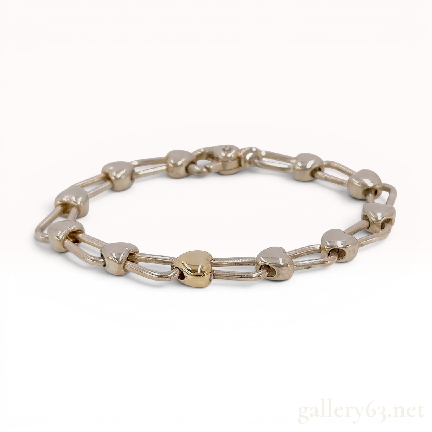 Tiffany and Co. Sterling Silver and 18 Karat Yellow Gold Heart Link Bracelet