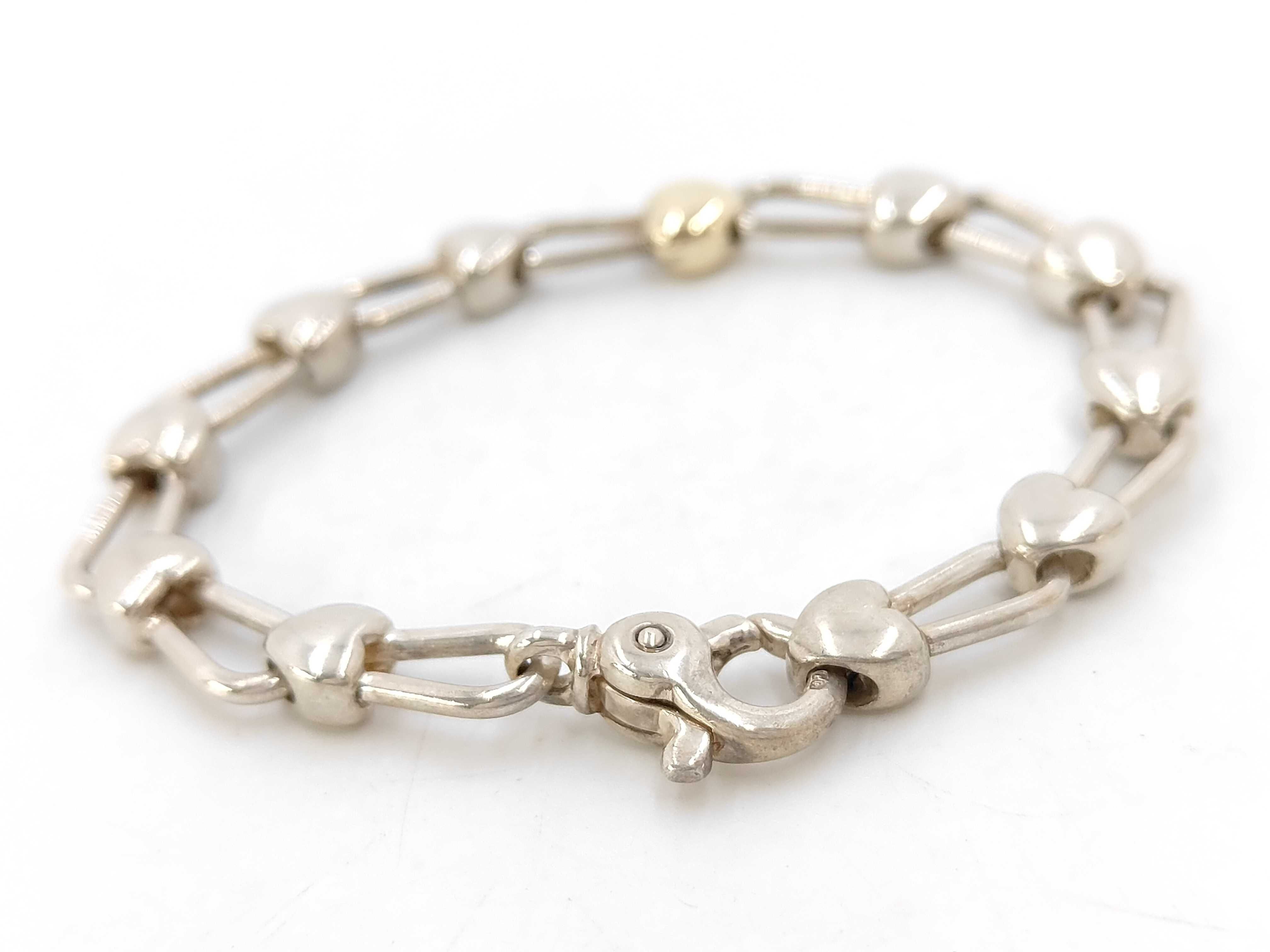 Tiffany and Co. Sterling Silver and 18 Karat Yellow Gold Heart Link Bracelet