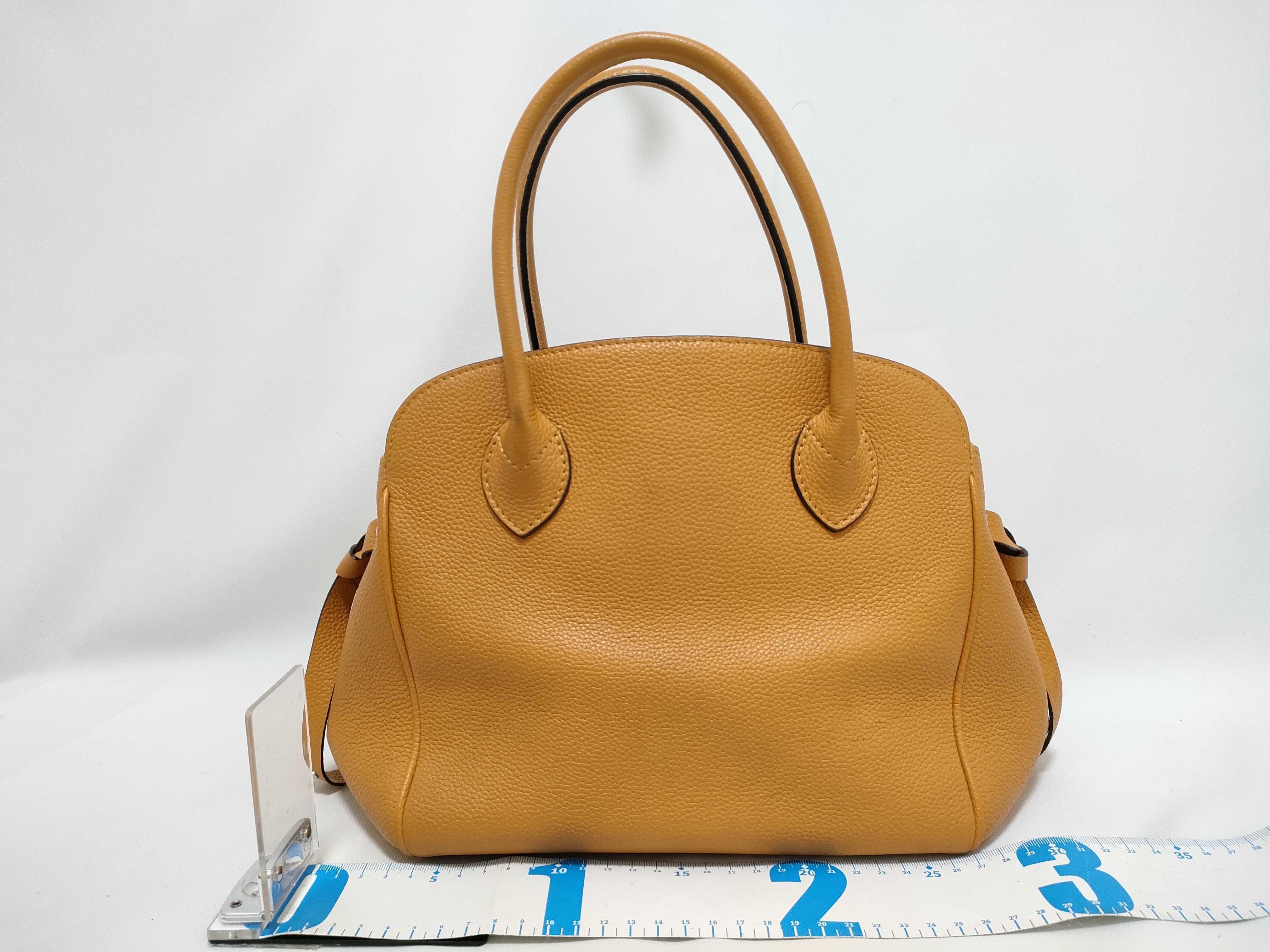Louis Vuitton Milla PM Taurillon Leather Handbag
