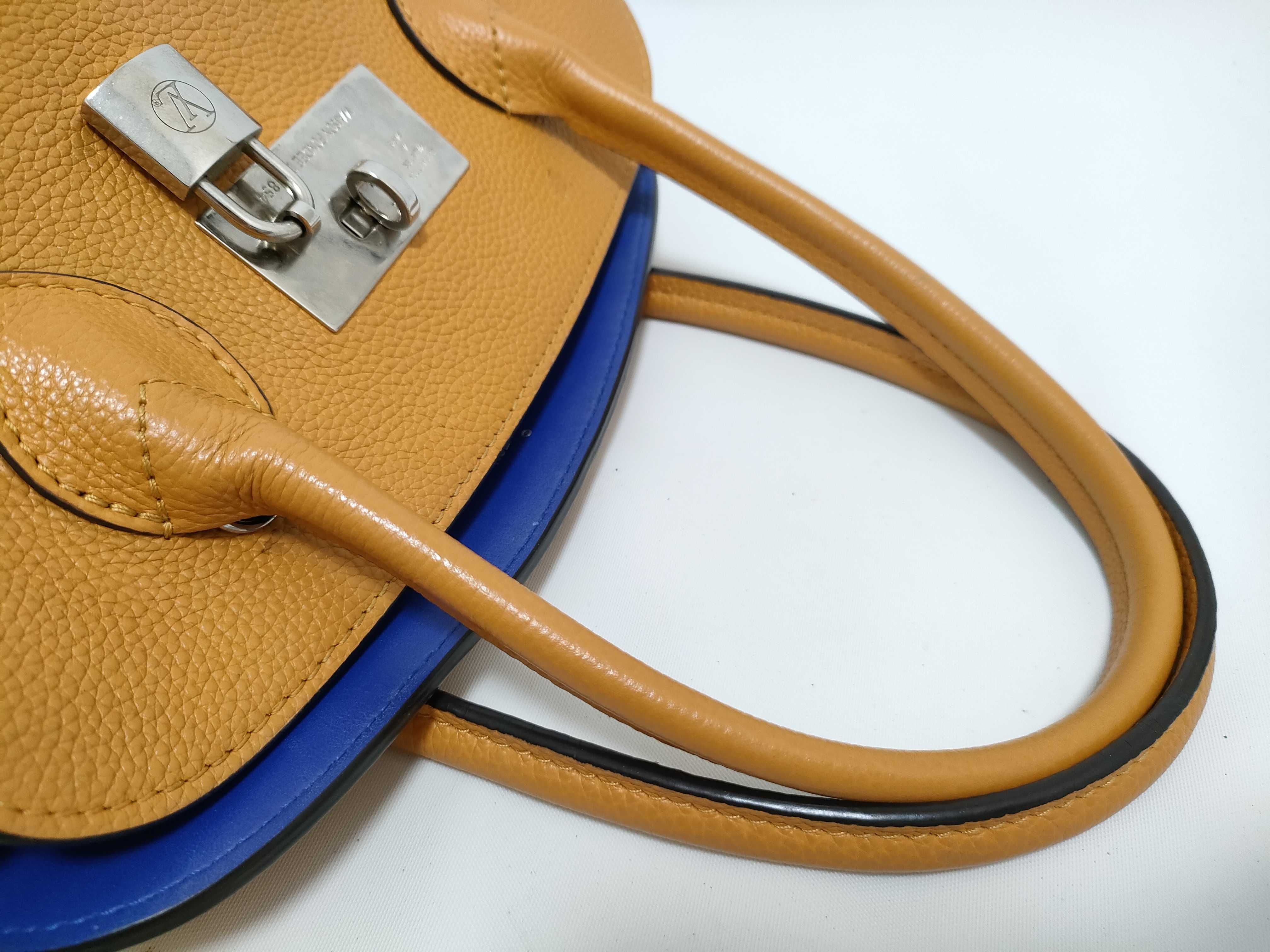 Louis Vuitton Milla PM Taurillon Leather Handbag