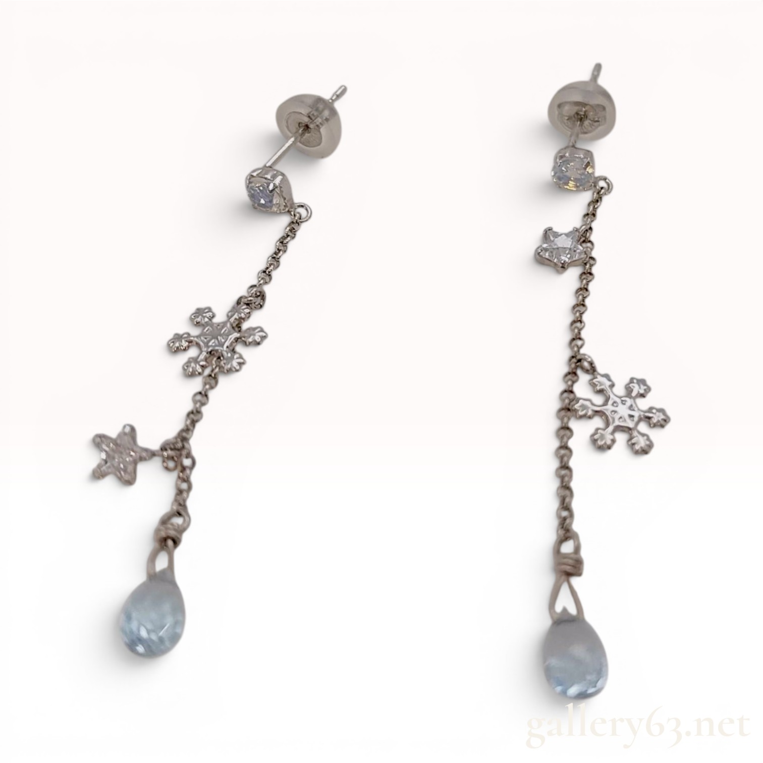 A Pair of 10K White Gold Celestial and Snowflake Drop Earrings