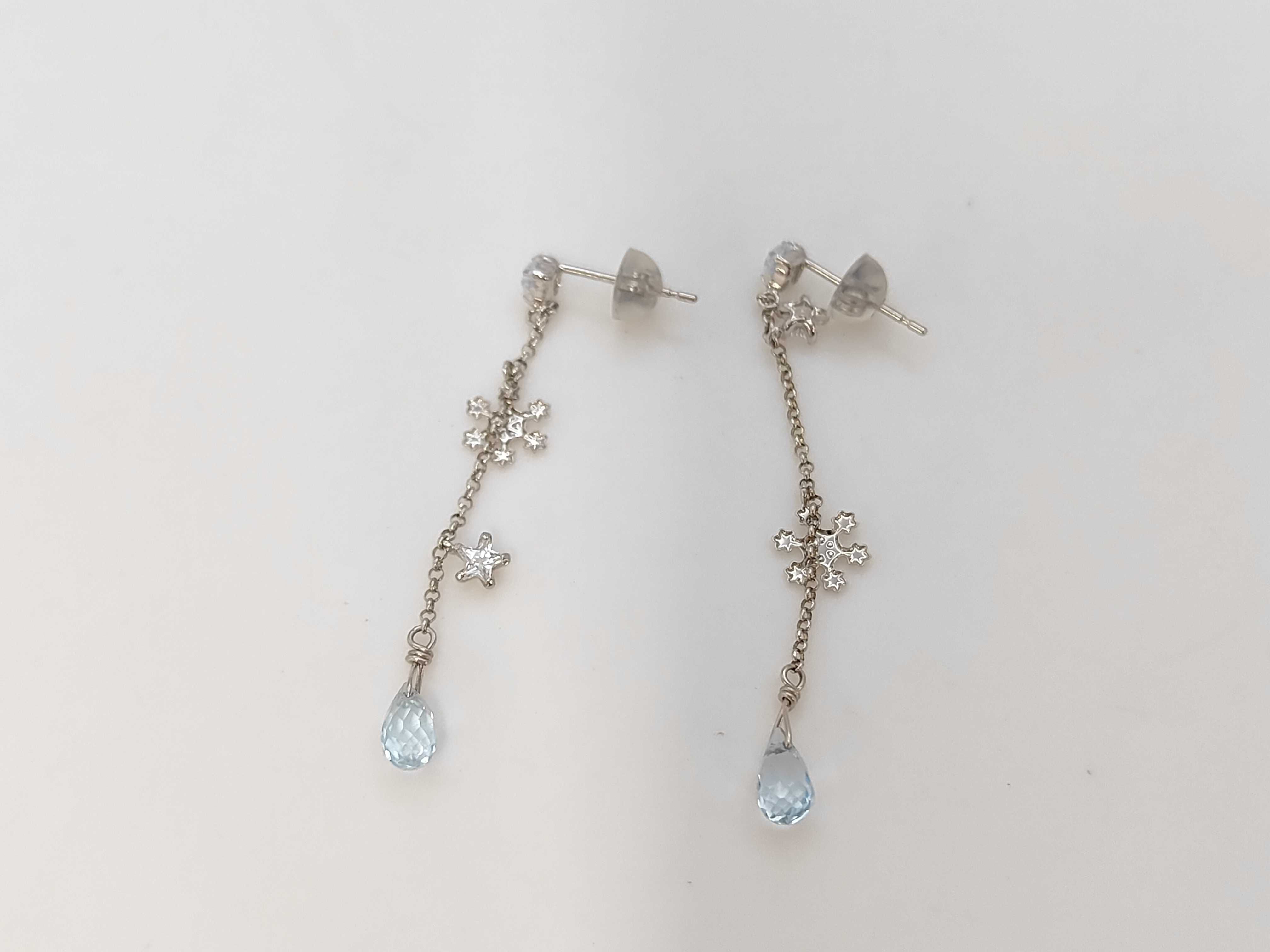 A Pair of 10K White Gold Celestial and Snowflake Drop Earrings
