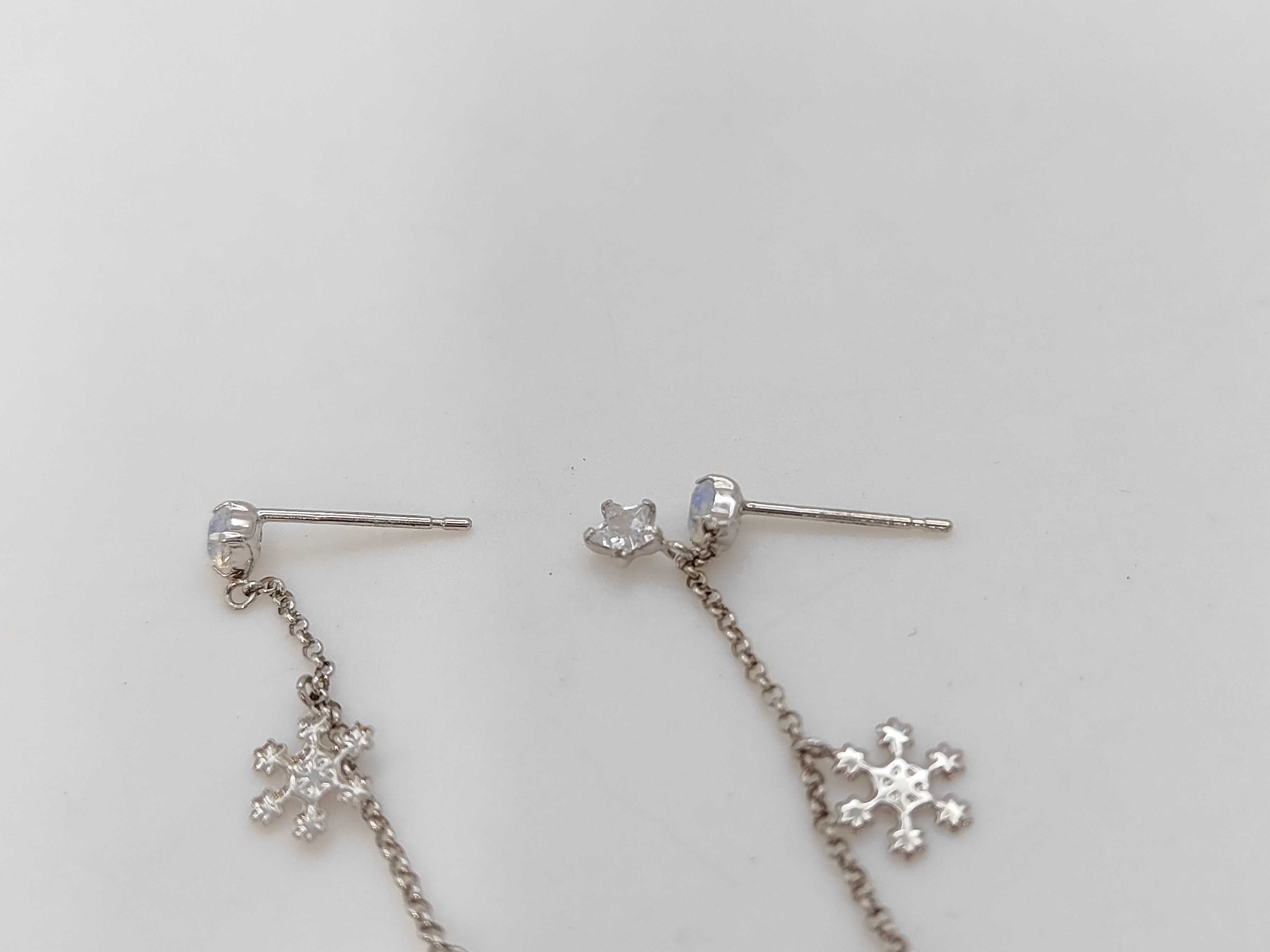 A Pair of 10K White Gold Celestial and Snowflake Drop Earrings