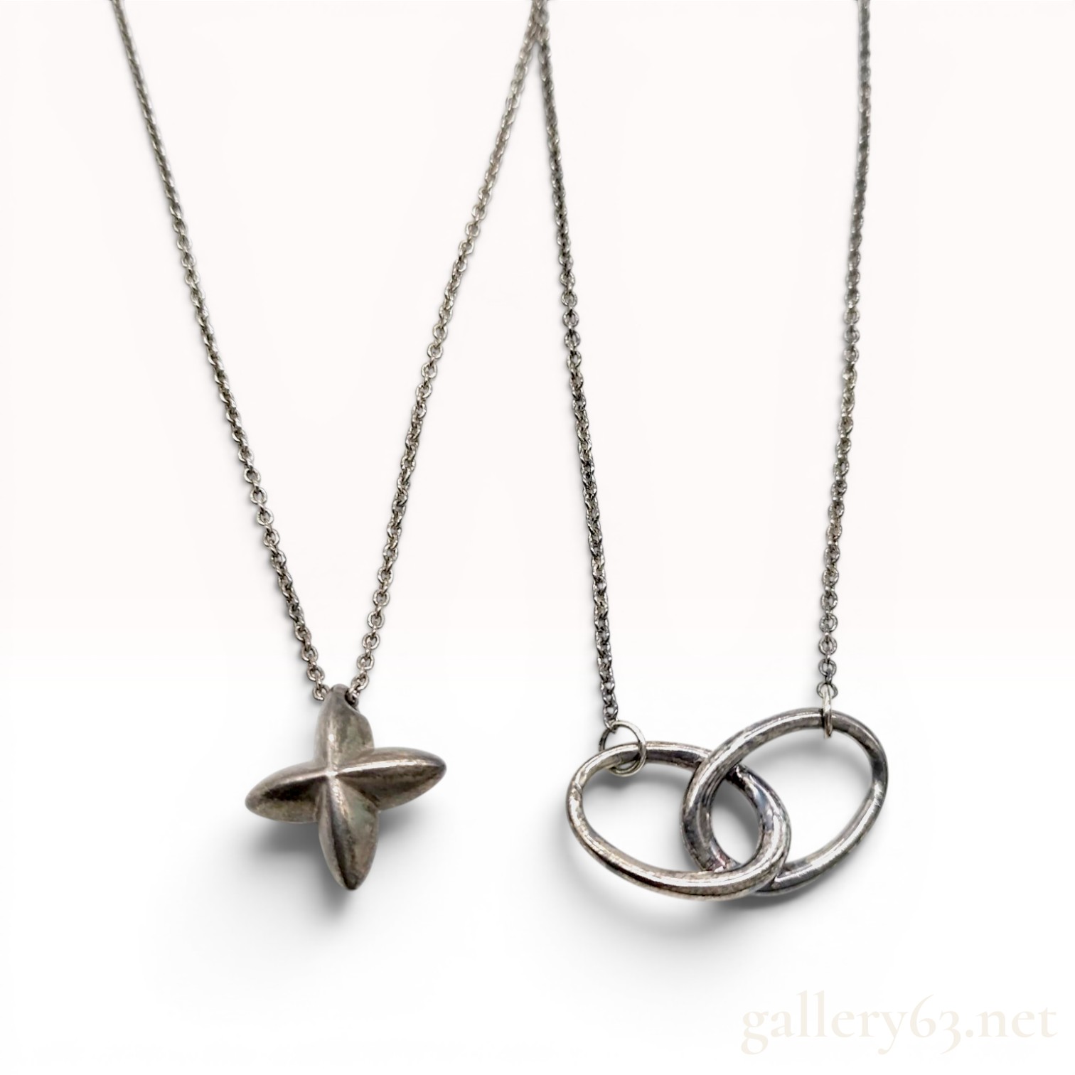 Two Tiffany and Co. Elsa Peretti Sterling Silver Star and Interlocking Circles Necklaces
