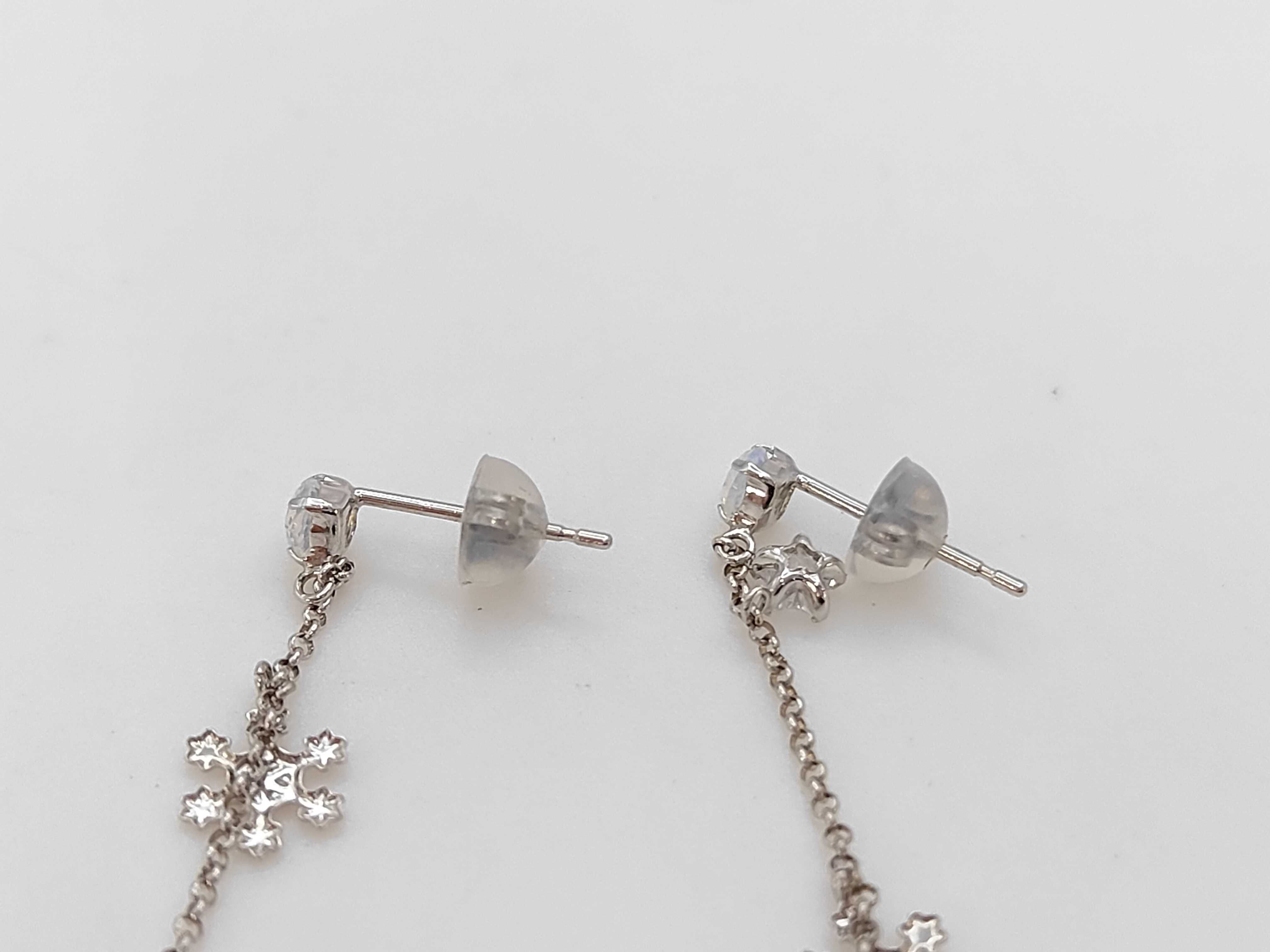 A Pair of 10K White Gold Celestial and Snowflake Drop Earrings