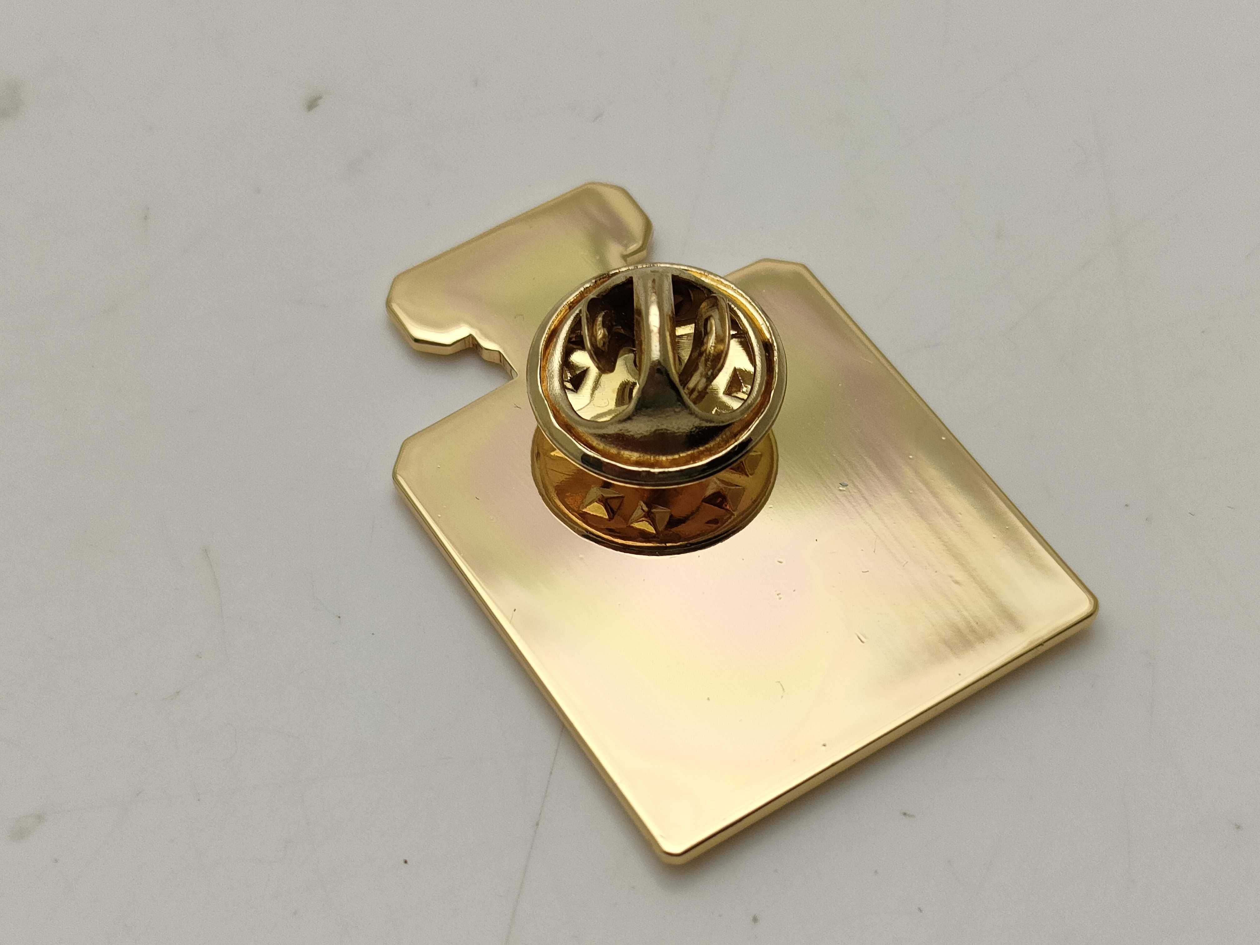 Two Chanel La Collection Gold-Toned Enamel Lapel Pins
