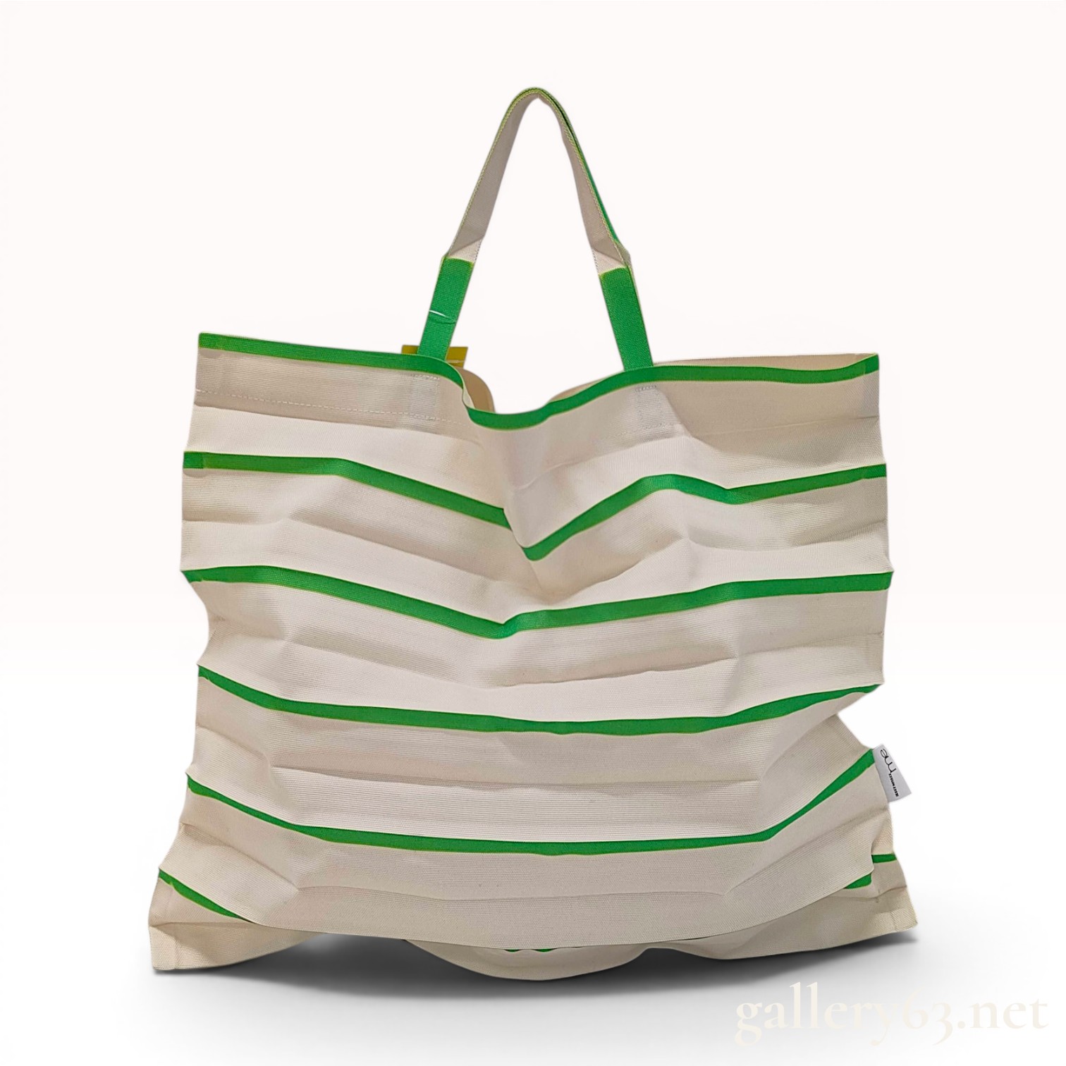 me ISSEY MIYAKE Striped Trunk Pleats Bag in Green and Cream