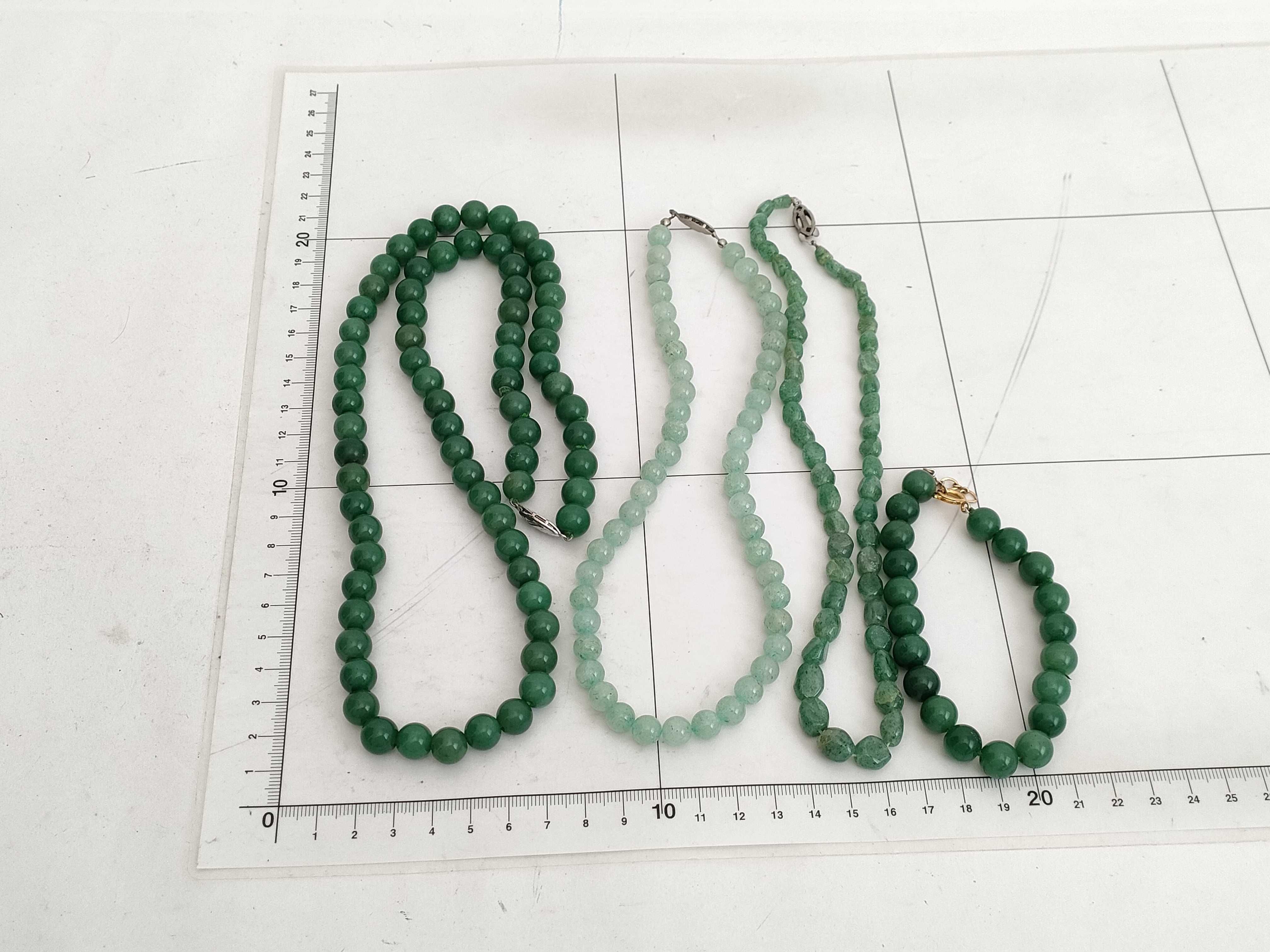 A Collection of Jadeite, Aventurine, and Beaded Stone Necklaces/Bracelets