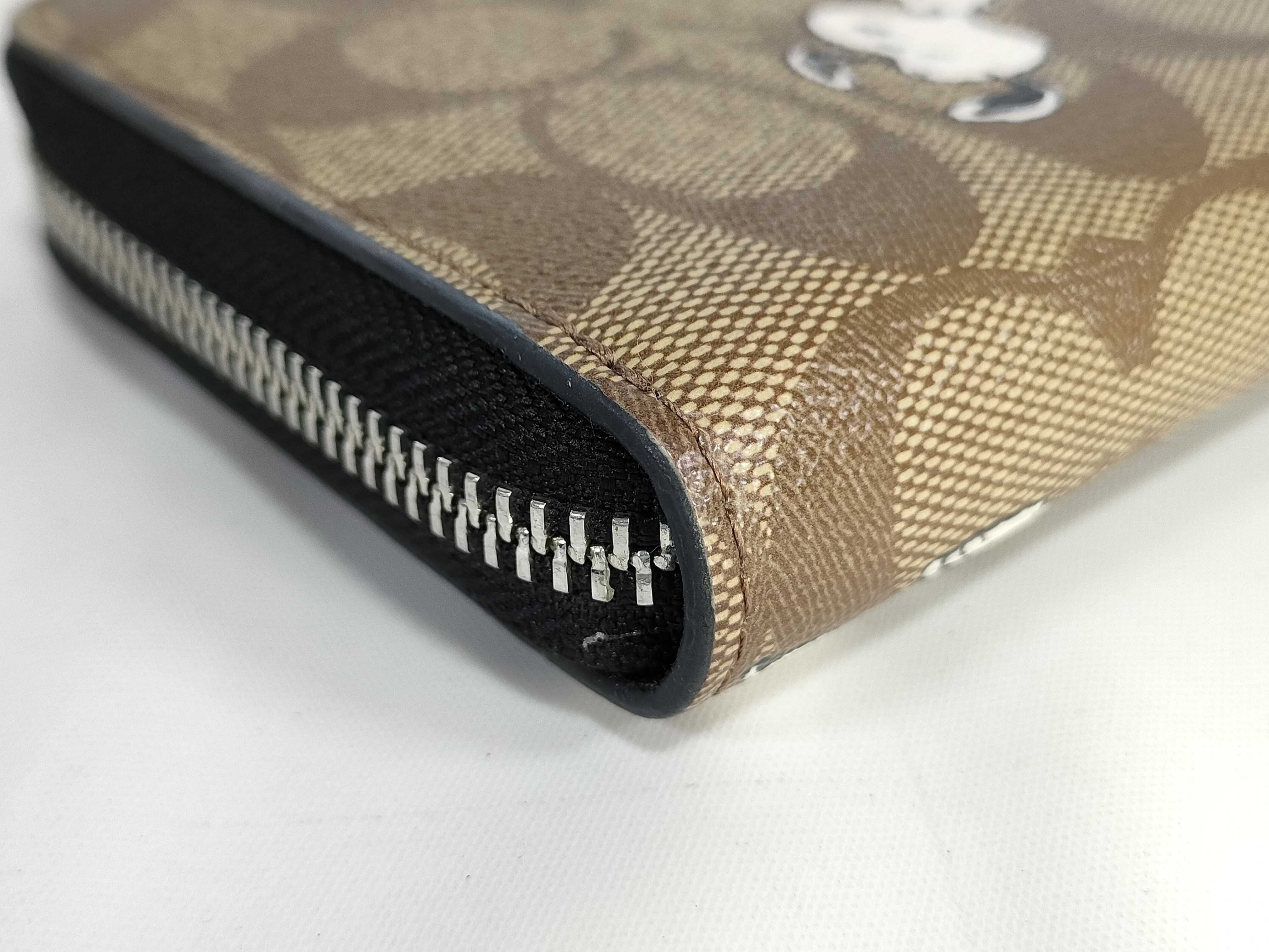 COACH x PEANUTS Long Zip Around Wallet in Signature Canvas with Snoopy