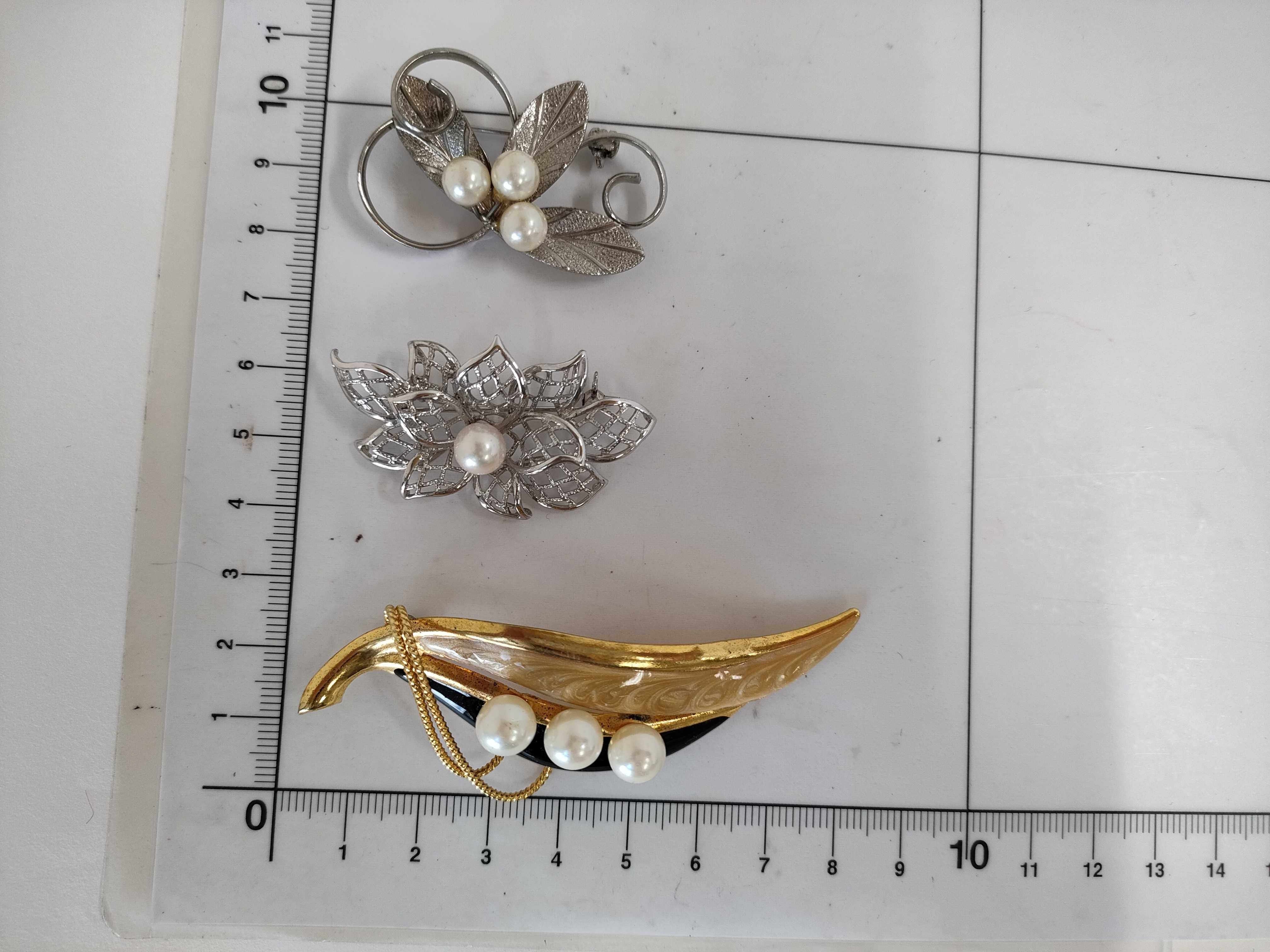 A Collection of Five Vintage Pearl and Botanical Brooches including Mikimoto