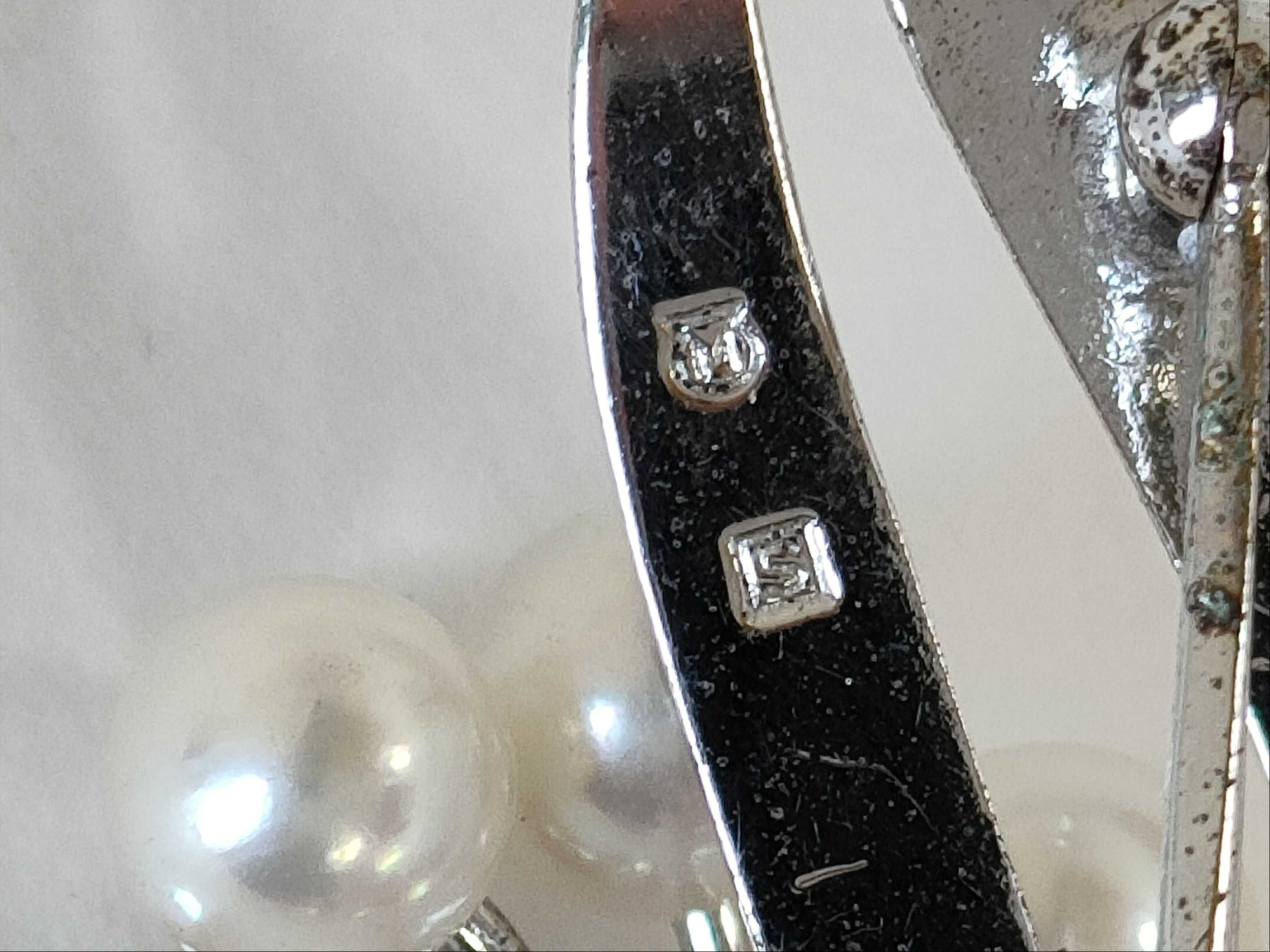A Collection of Five Vintage Pearl and Botanical Brooches including Mikimoto
