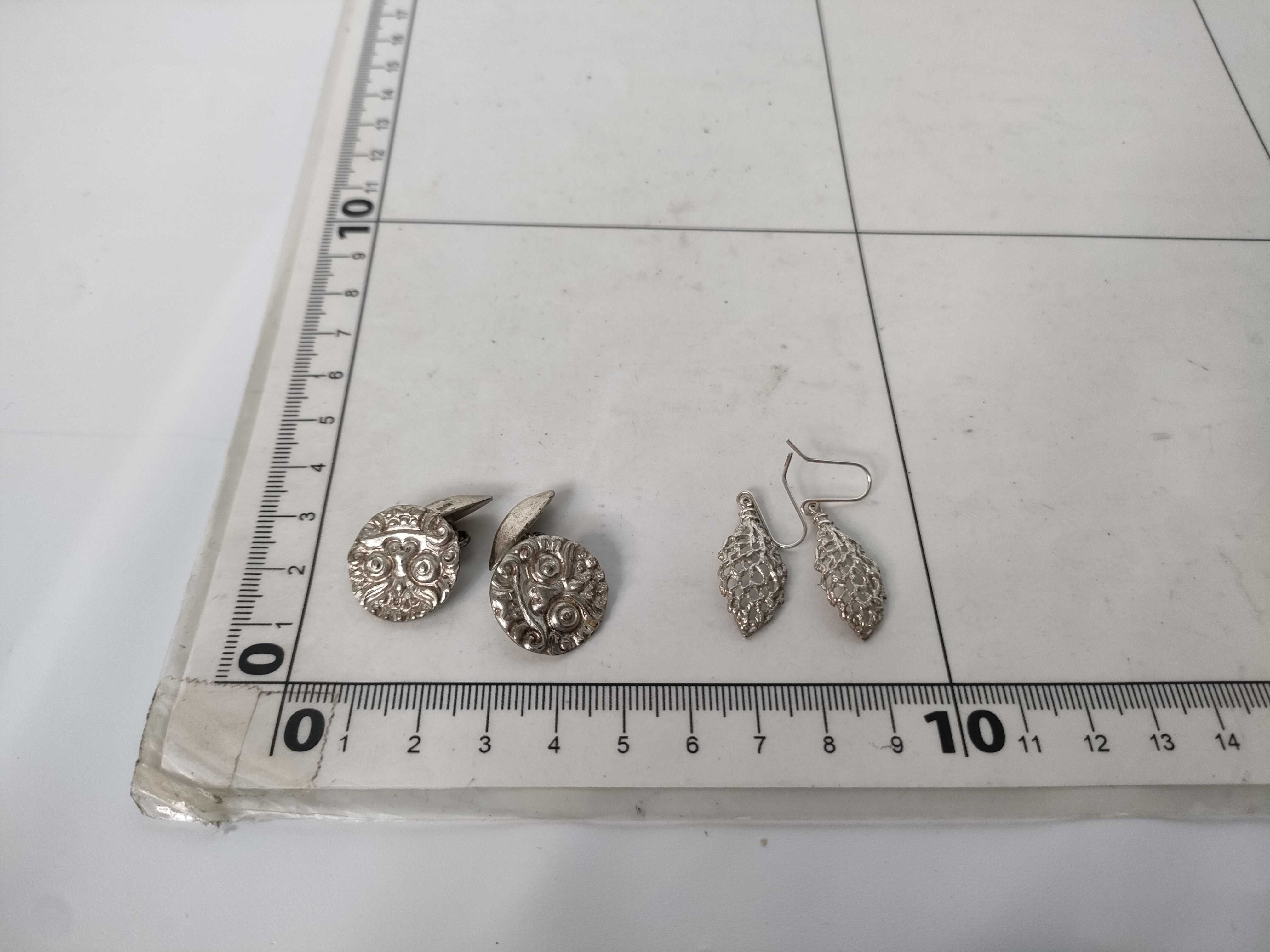 A Collection of Four Sets of Silver and.800 Silver Jewelry Including Spinx Cufflinks