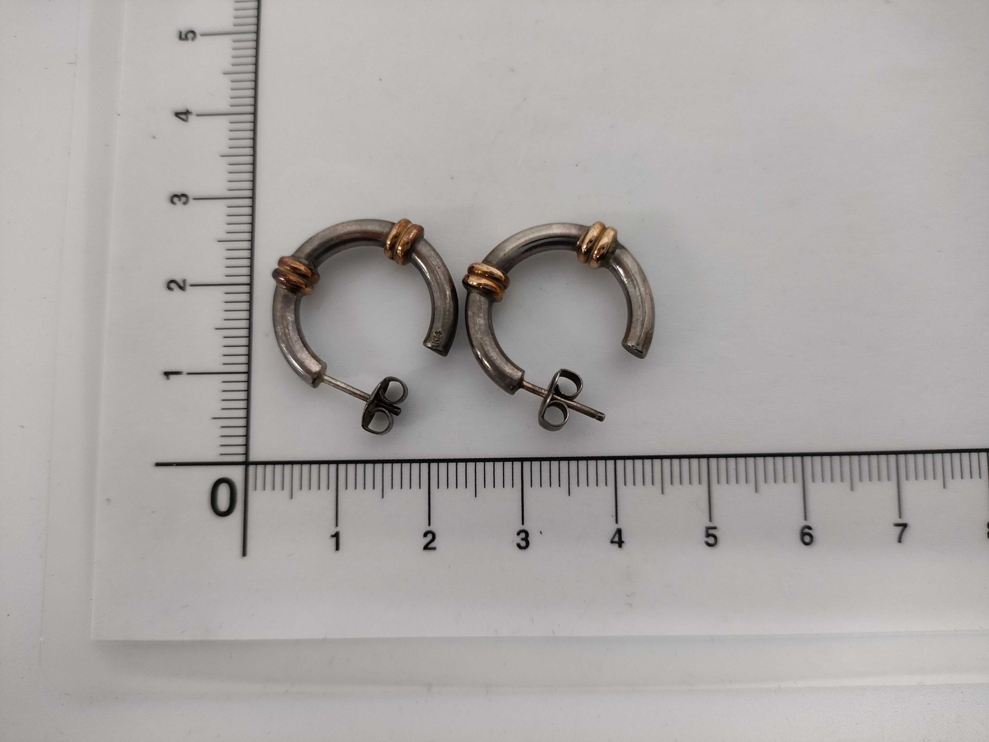 A Pair of Sterling Silver and 14 Karat Gold Two-Tone Hoop Earrings